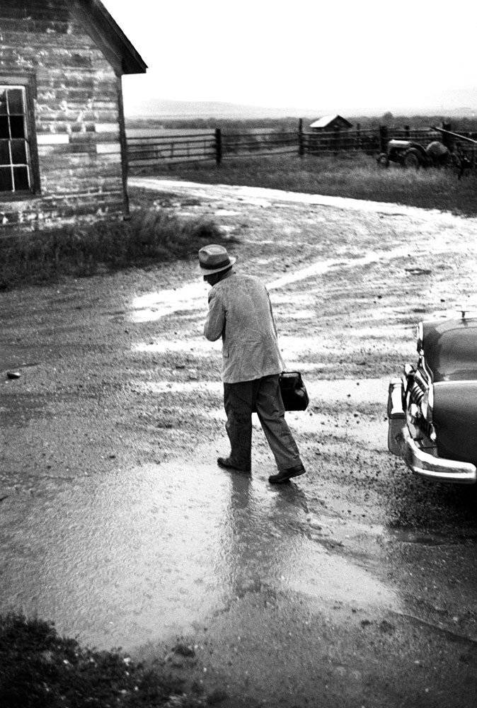 Not published in LIFE. Dr. Ernest Ceriani on his way to a house call in foul weather, Kremmling, Colo., 1948.