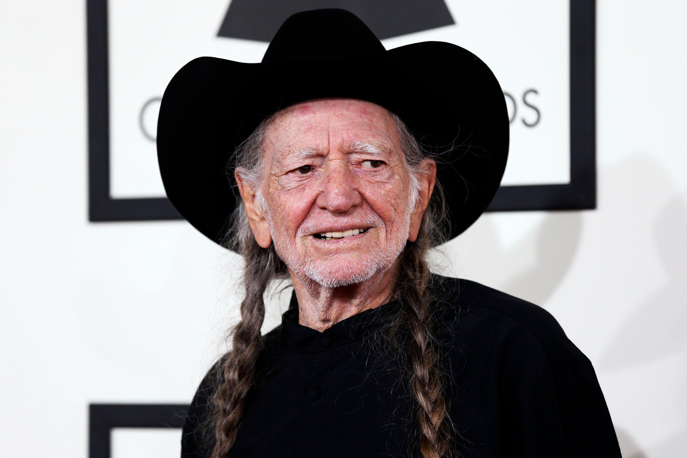 Musician Willie Nelson arrives at the 56th annual Grammy Awards in Los Angeles
