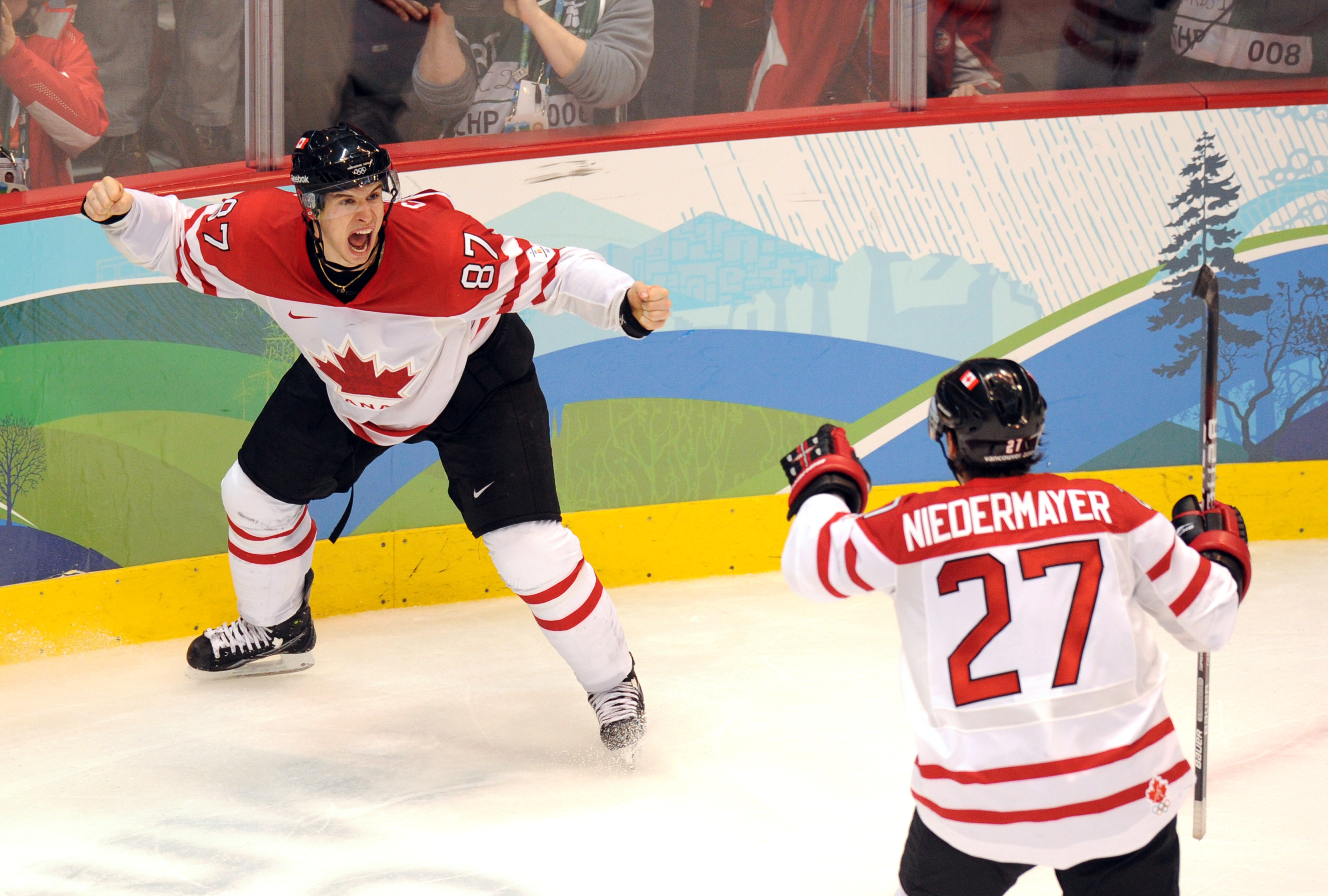 Canadian forward Sidney Crosby (87) and Canadian defenseman Scott Niedermayer (27) jubilate as their team wins gold against the USA in the Men's Gold Medal Hockey match at the Canada Hockey Place during the XXI Winter Olympic Games in Vancouver, Canada on February 28, 2010. (Yuri Kadobnov&mdash;AFP/Getty Images)