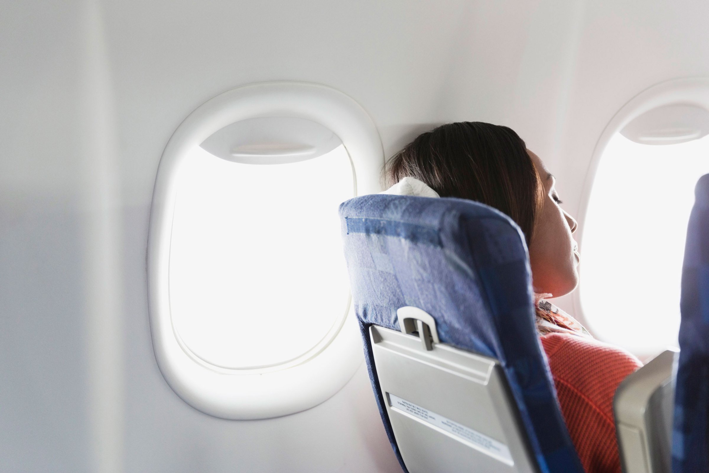 Woman sleeping in airplane