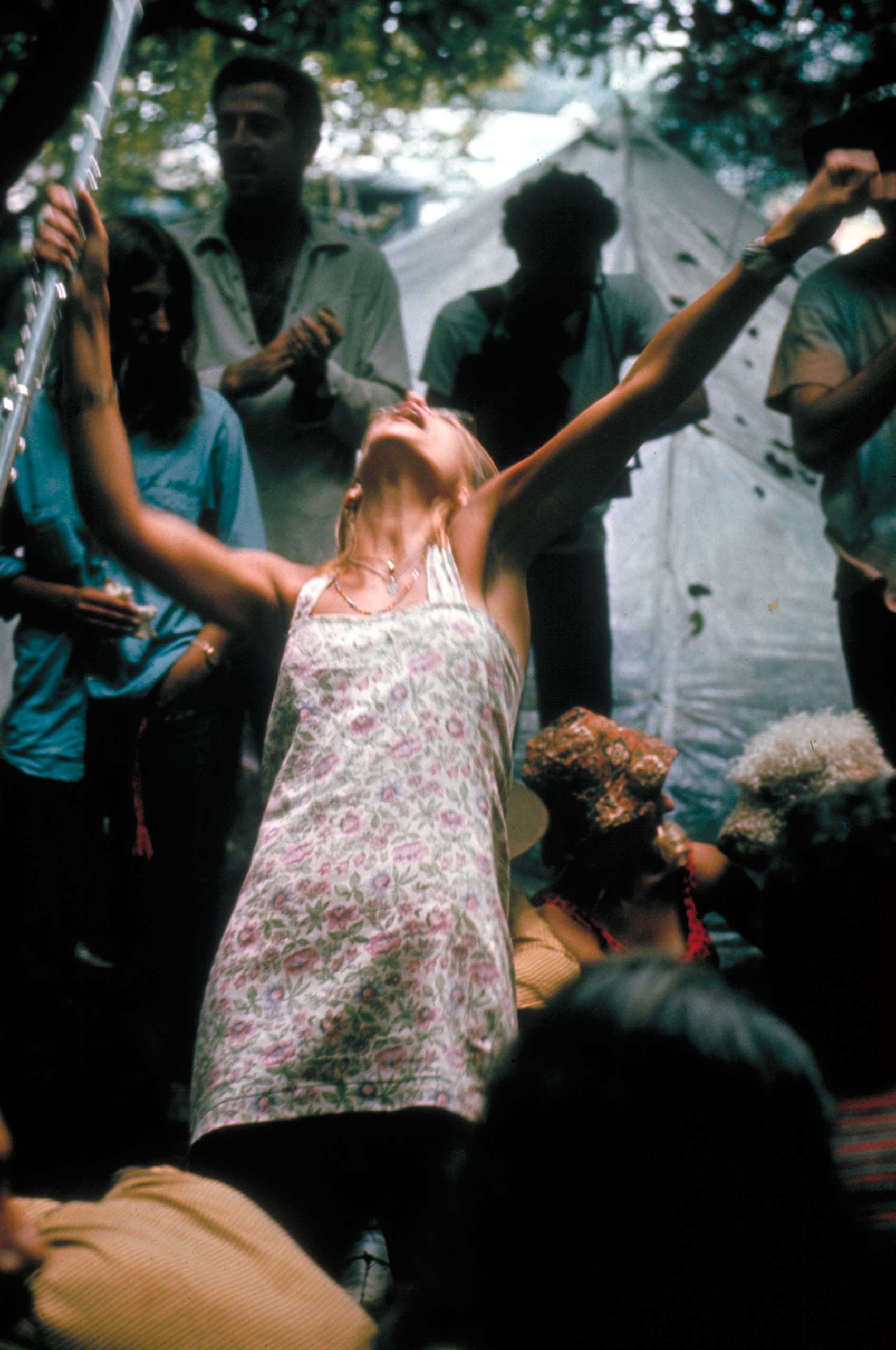 <b>Caption from LIFE.</b> "Overcome by the driving rhythm, a lady flutist abandons herself to dance during an impromptu amateur performance in the woods." Woodstock, 1969. (Bill Eppridge&mdash;Time &amp; Life Pictures/Getty Images)