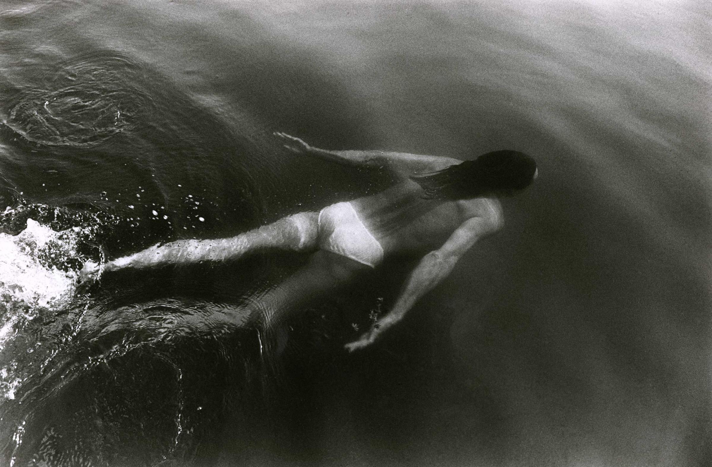 Peta swims in a lake on the Pine Ridge (Lakota) Indian Reservation in South Dakota, during a trip home with photographer Therese Frare in July 1991.