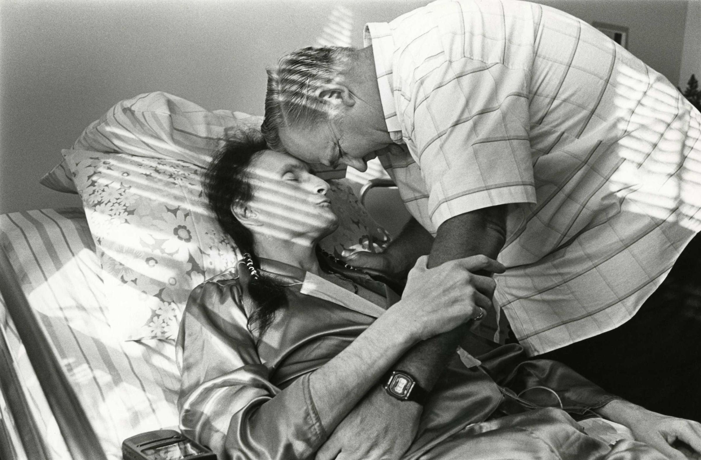 Peta and Bill Kirby share a quiet moment together in Peta's room, Ohio, 1992.
