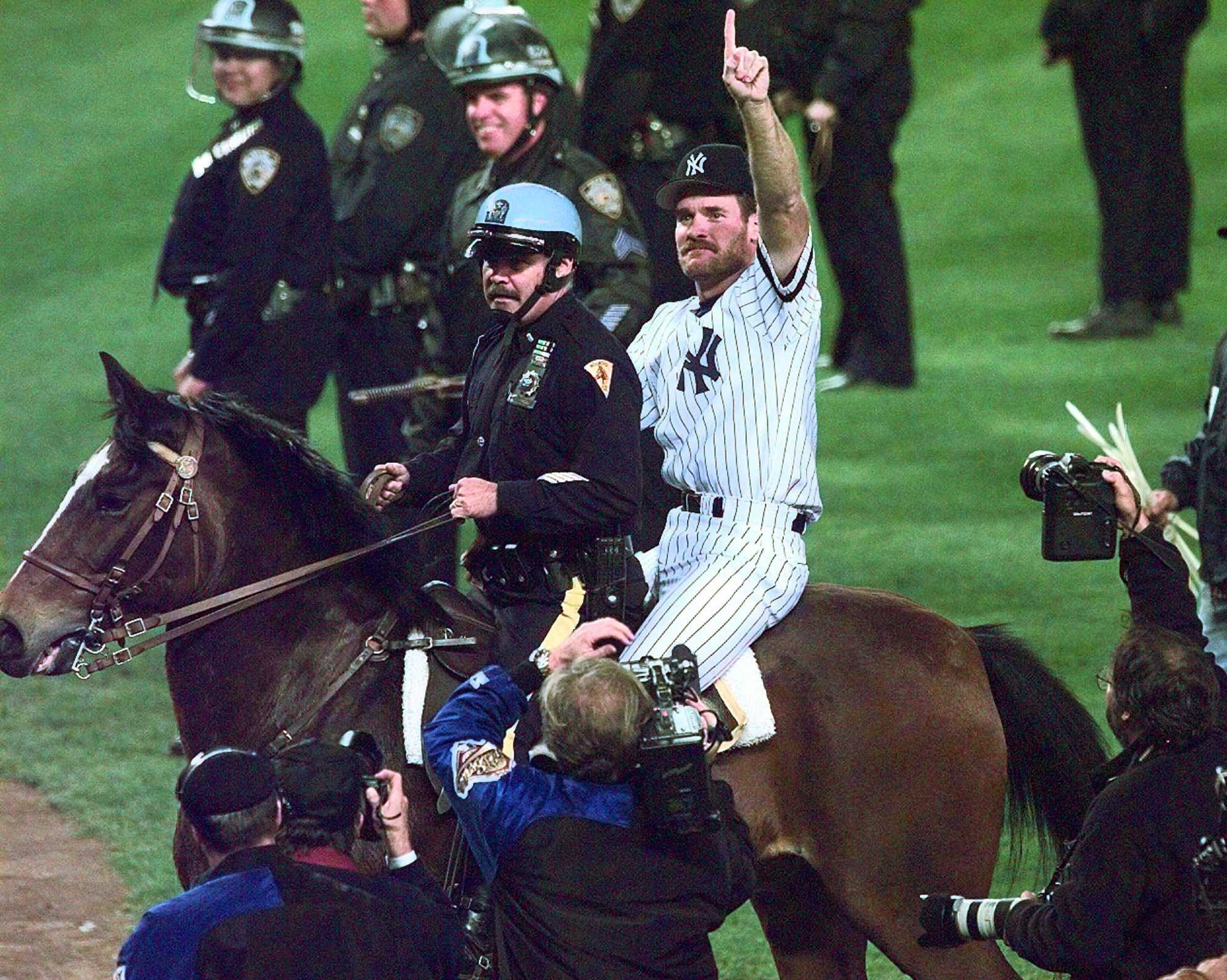 New York Yankees Wade Boggs rides a police horse around the field after the Yankees defeated the Atlanta Braves 3-2 in Game 6 of the World Series to win the Series at Yankee Stadium in New York, Saturday, Oct. 26, 1996.
