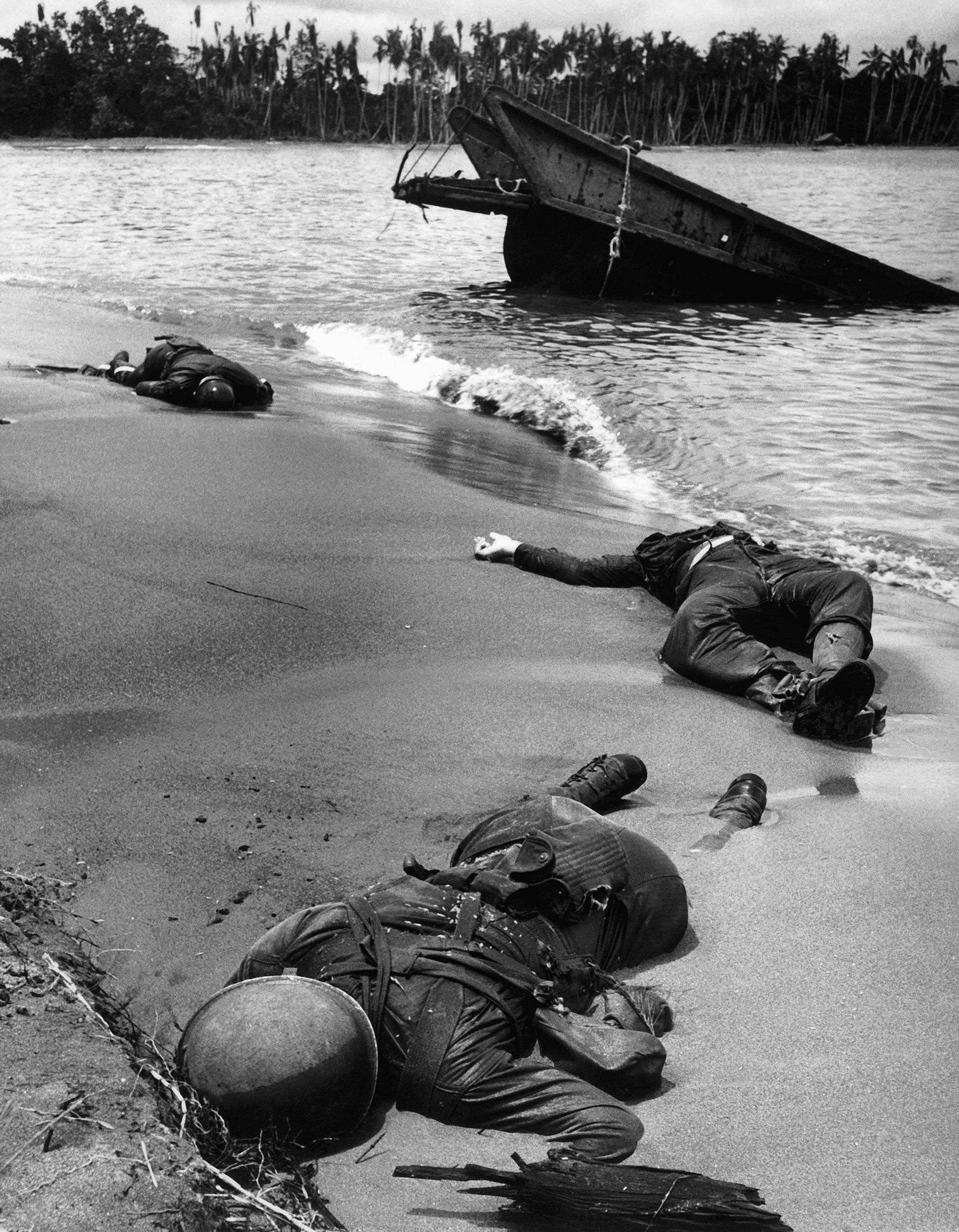 <b>Caption from LIFE.</b> "Three dead Americans on the beach at Buna." (George Strock—Time &amp; Life Pictures/Getty Images)