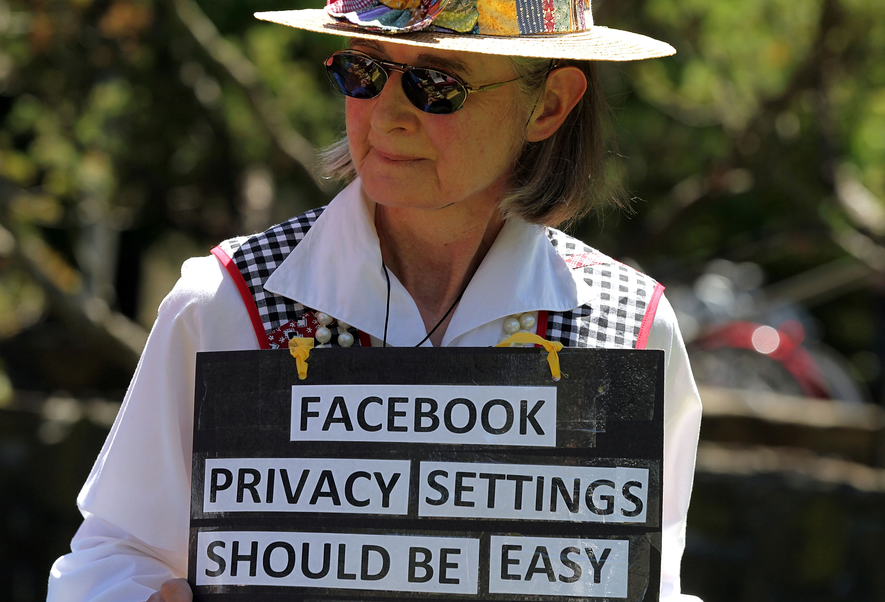 Mary Guedon of the group Raging Grannies holds a sign as she protests outside of the Facebook headquarters June 4, 2010 in Palo Alto, California. (Justin Sullivan—Getty Images)