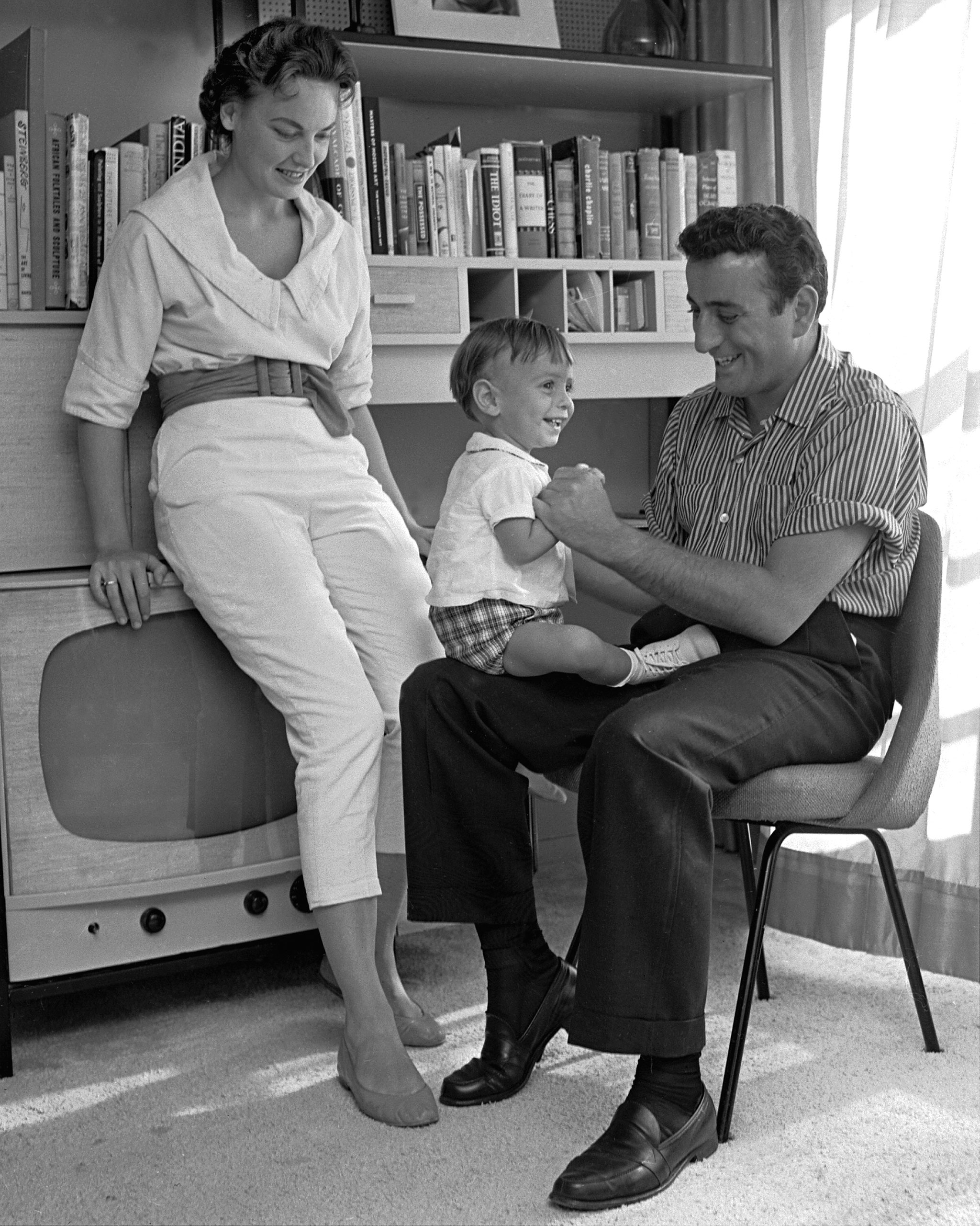 Singer Tony Bennett and his wife, Sandy, plays with their young son, D'Andrea in their apartment in the Riverdale section of the Bronx.