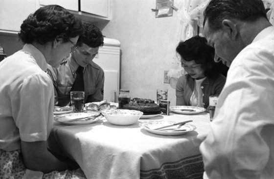 Eating dinner, family sits at a table in the kitchen. Before meal was over, Blue overcame shyness, began correcting Johnie's manners.