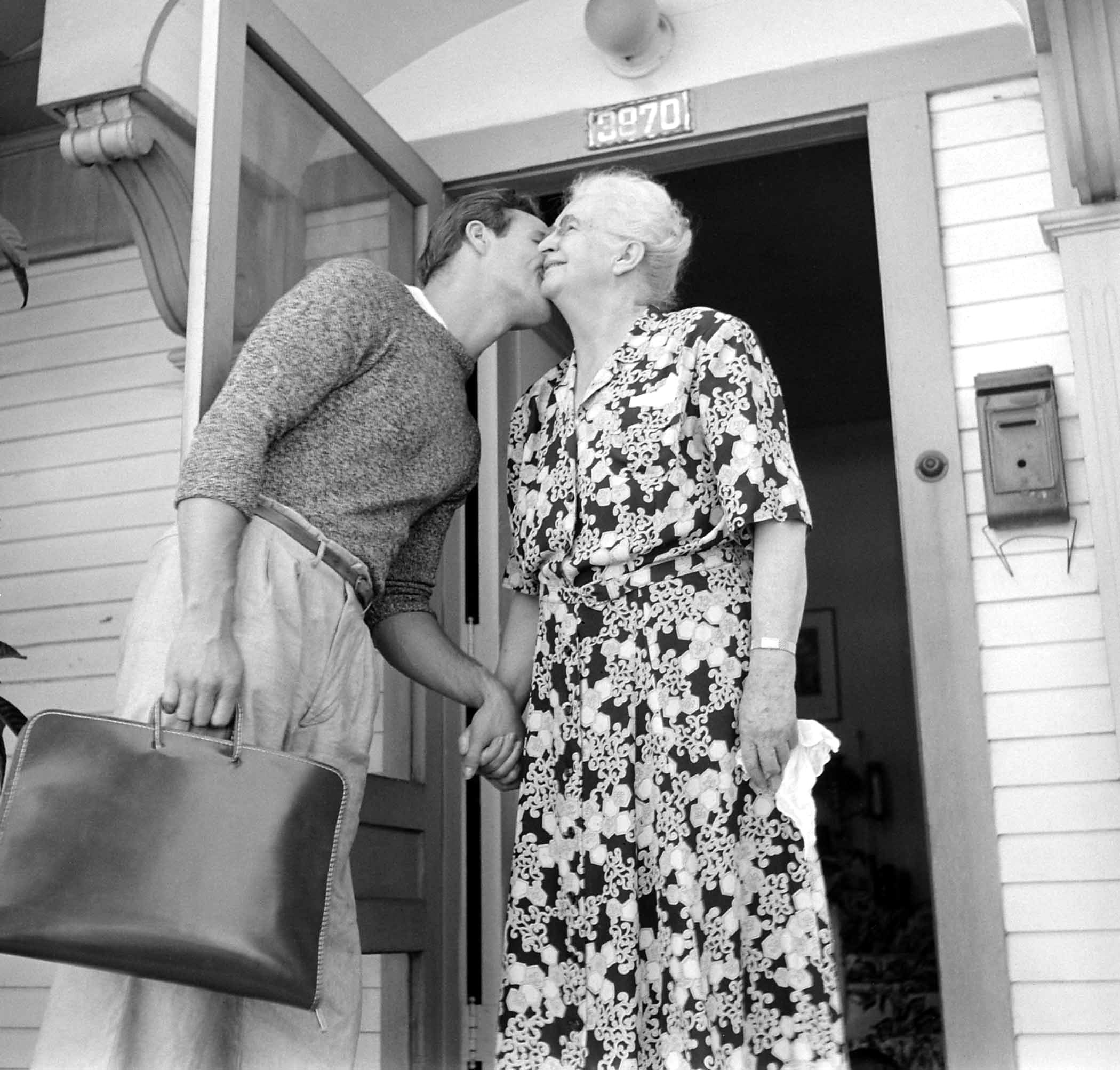 Marlon Brando kisses his grandmother as he heads to the studio for a day of filming The Men, 1949.