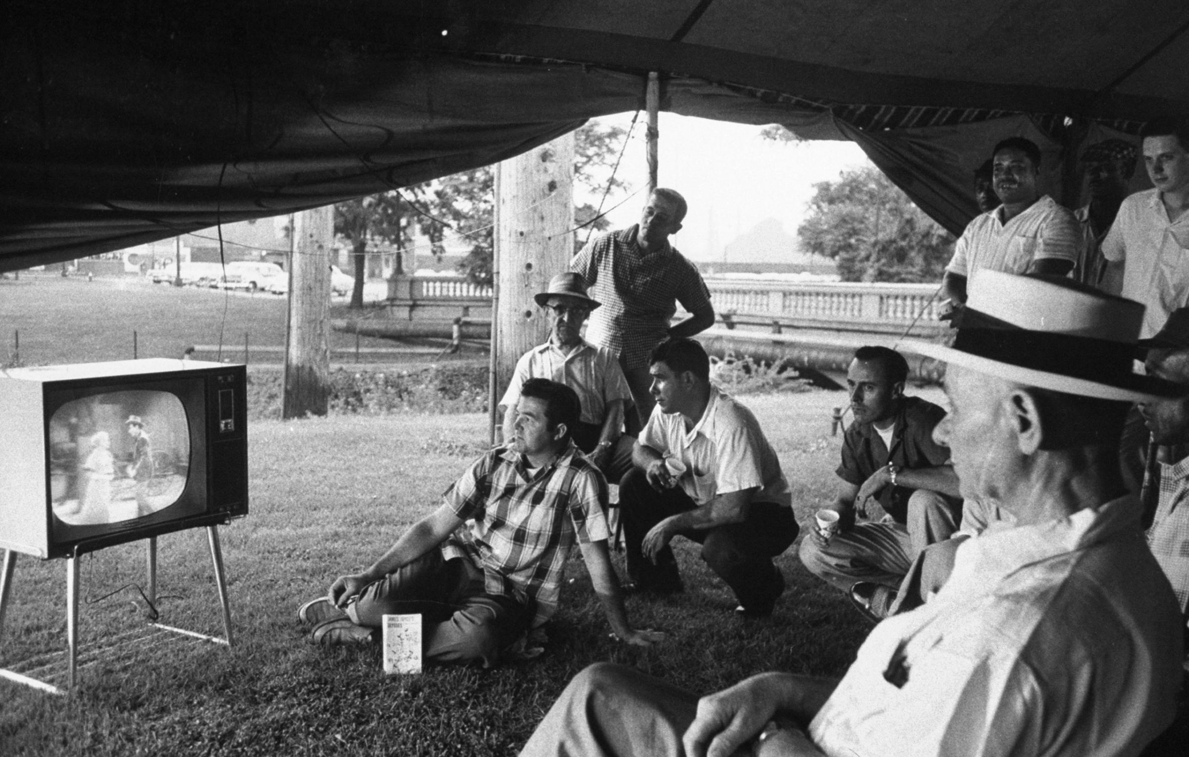 Picketers watch TV in a tent outside the gates of a U.S. Steel plant in Gary, Indiana, during a strike in 1959.