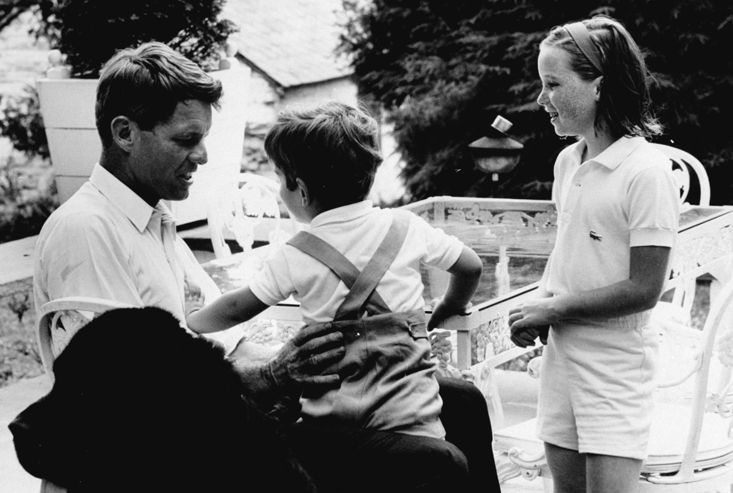 Robert Kennedy with John Kennedy Jr. and his daughter Courtney, 1964.