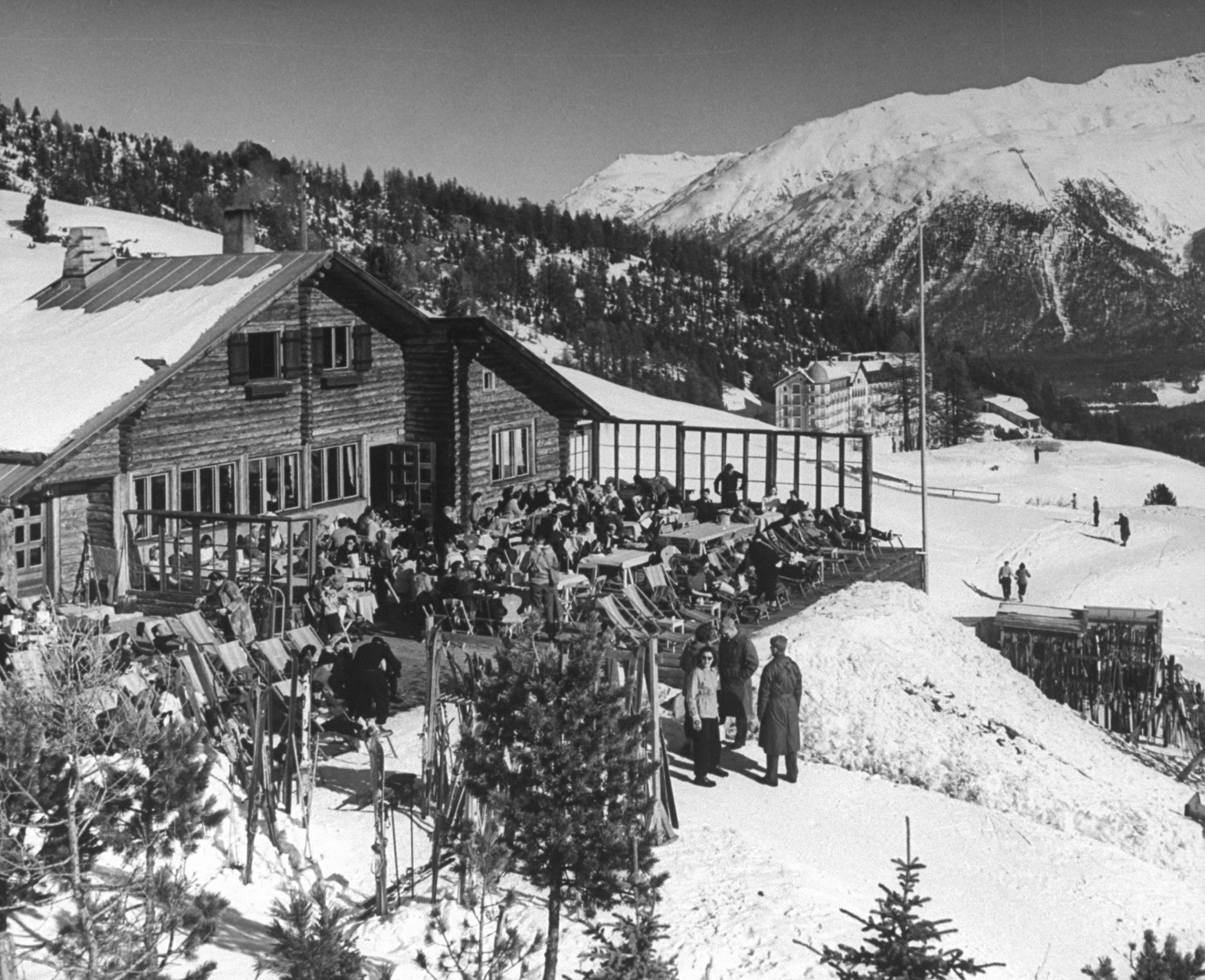 Snow-covered winter-resort village. Hotel Chantarella in background. St. Moritz, 1947.