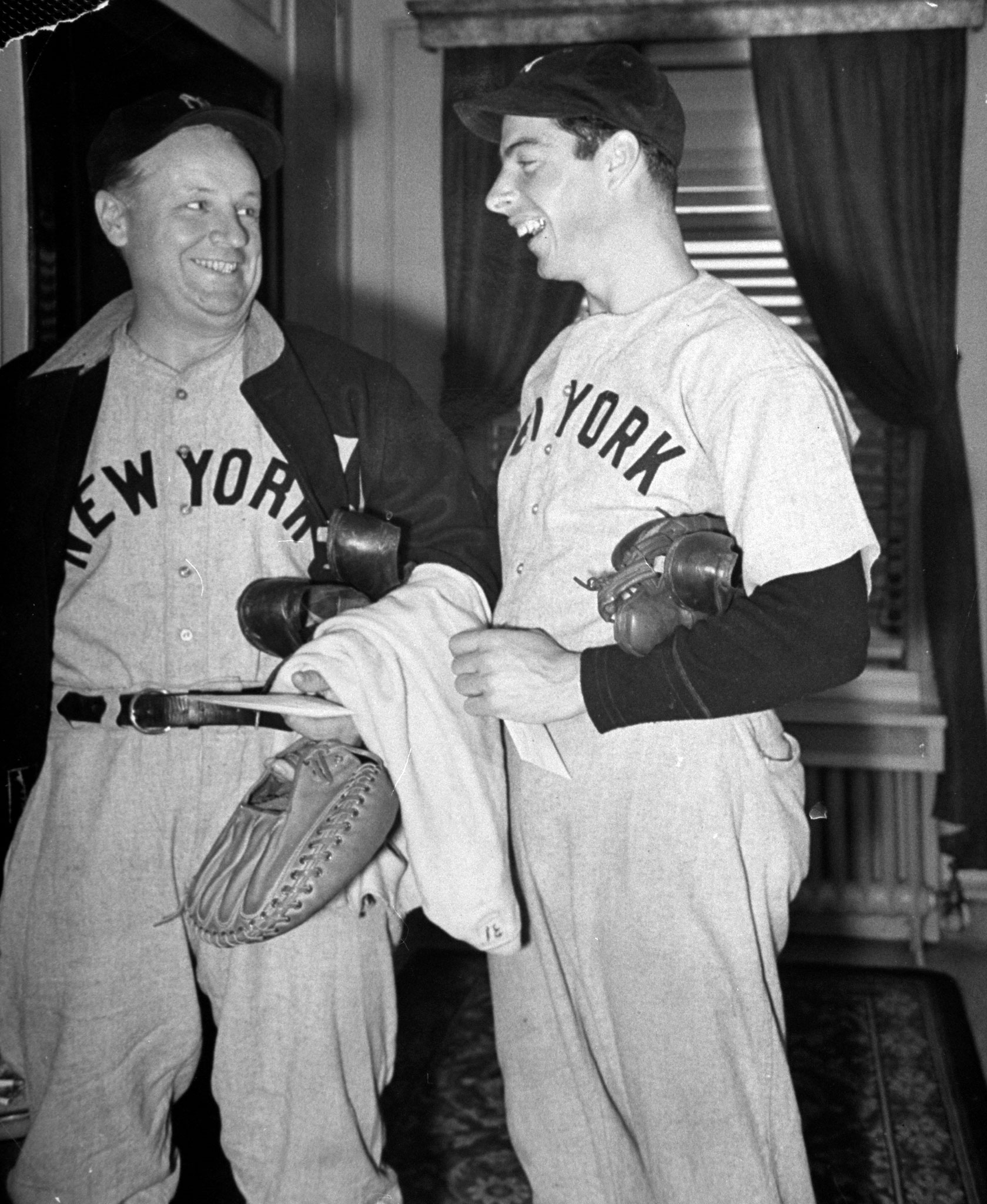 Joe DiMaggio (right) shares a laugh, 1939.