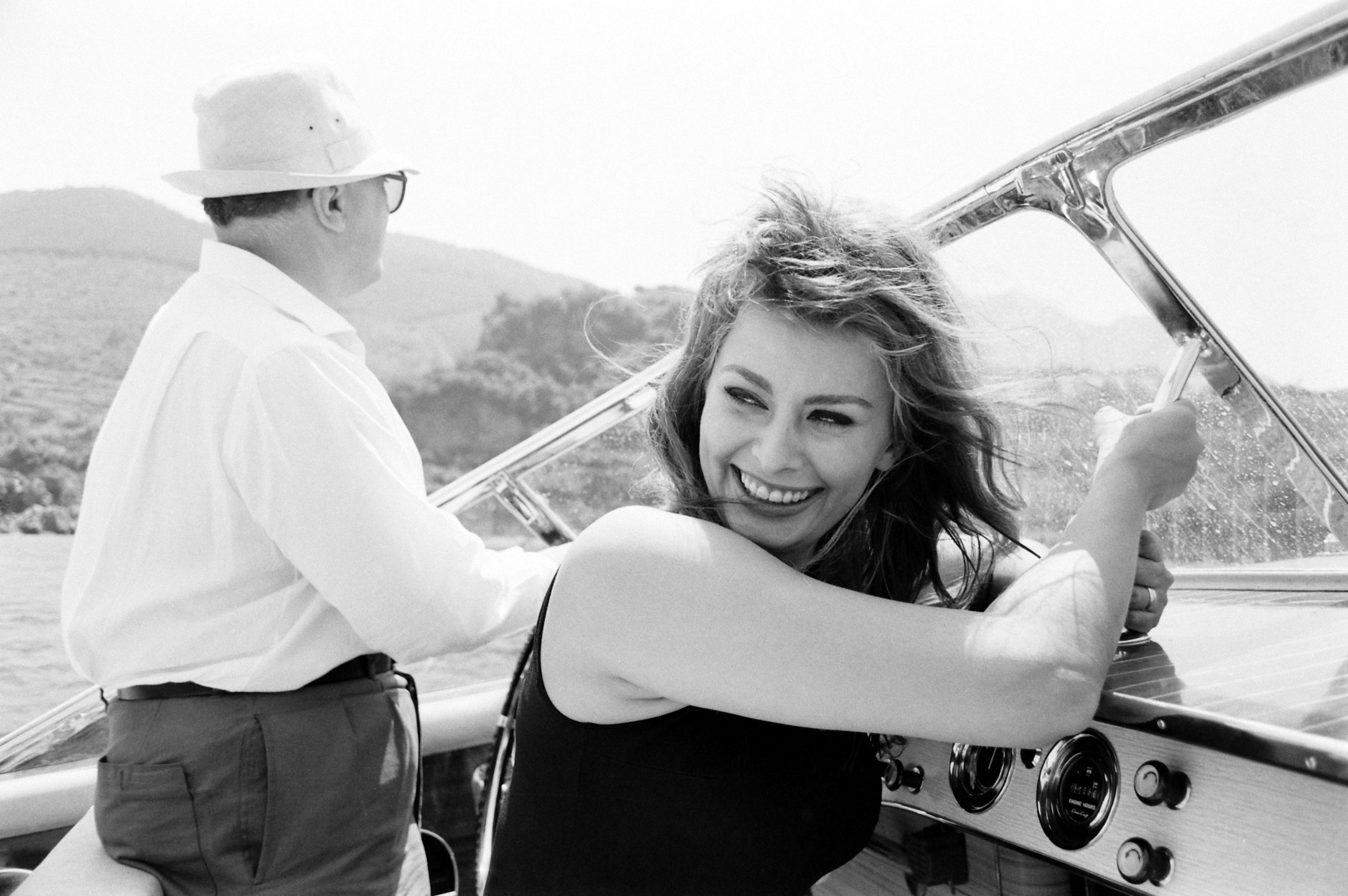 Sophia Loren with her husband Carlo Ponti on a boating trip off of Naples, 1961.