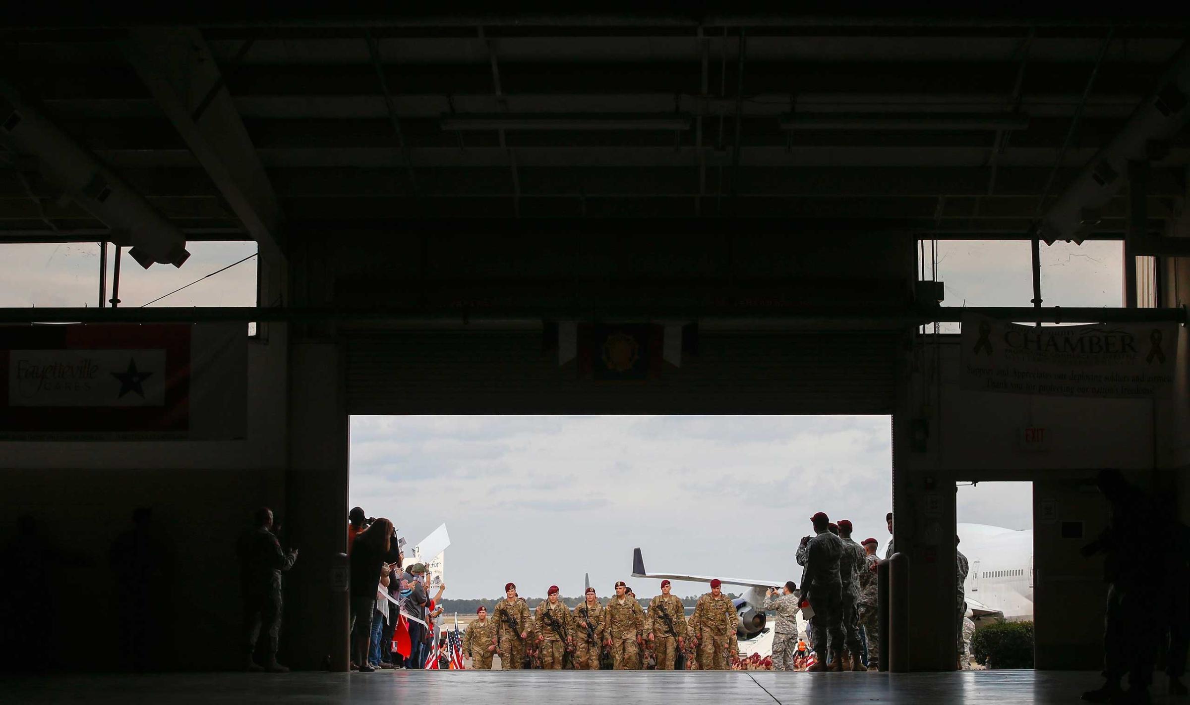 Paratroopers with the 1st Brigade Combat Team, 82nd Airborne Division march up the ramp as they return home from Afghanistan, at Pope Army Airfield in Fort Bragg