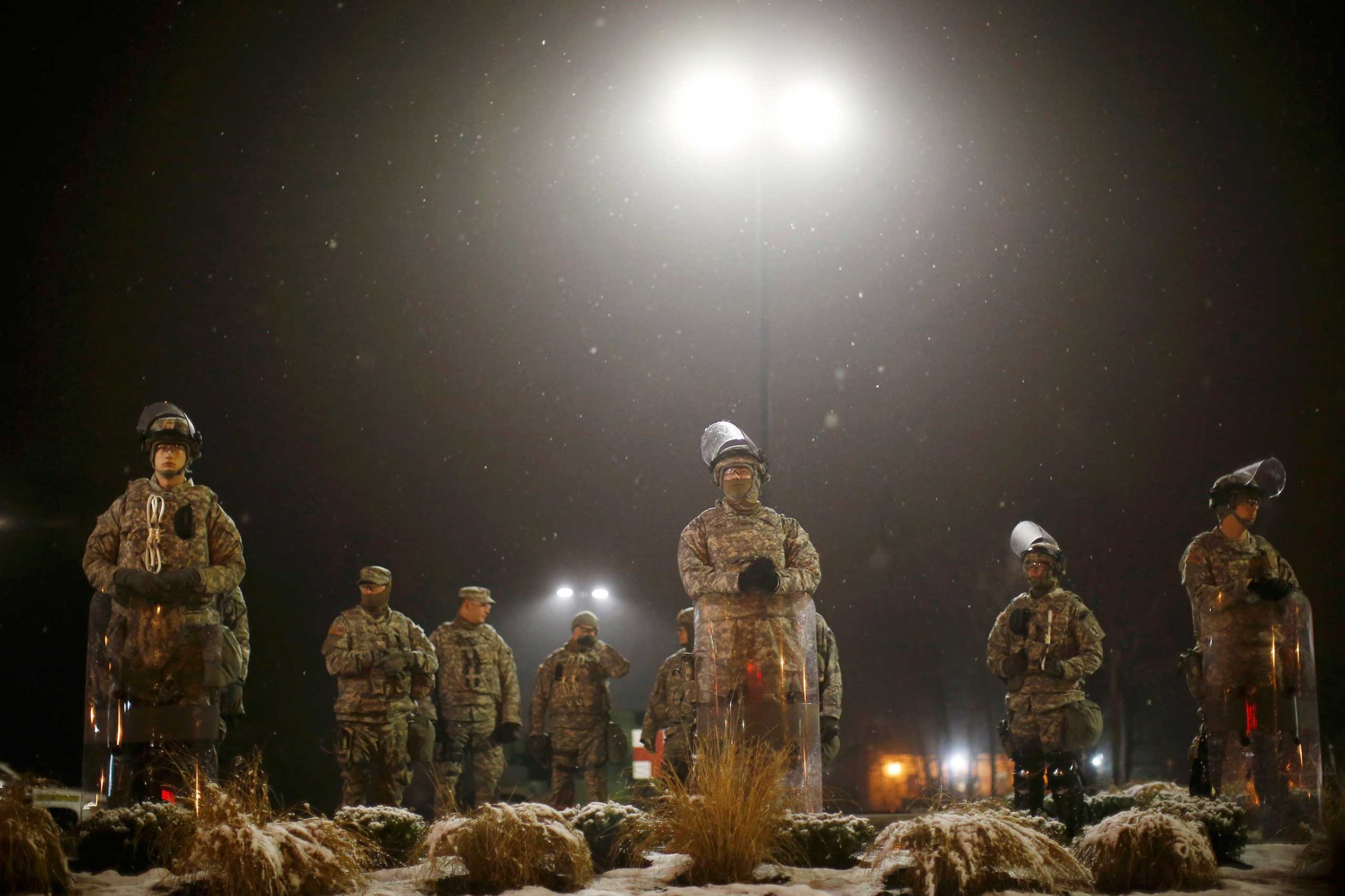 Missouri National Guardsmen stand guard at the Ferguson Police Station in Ferguson Missouri