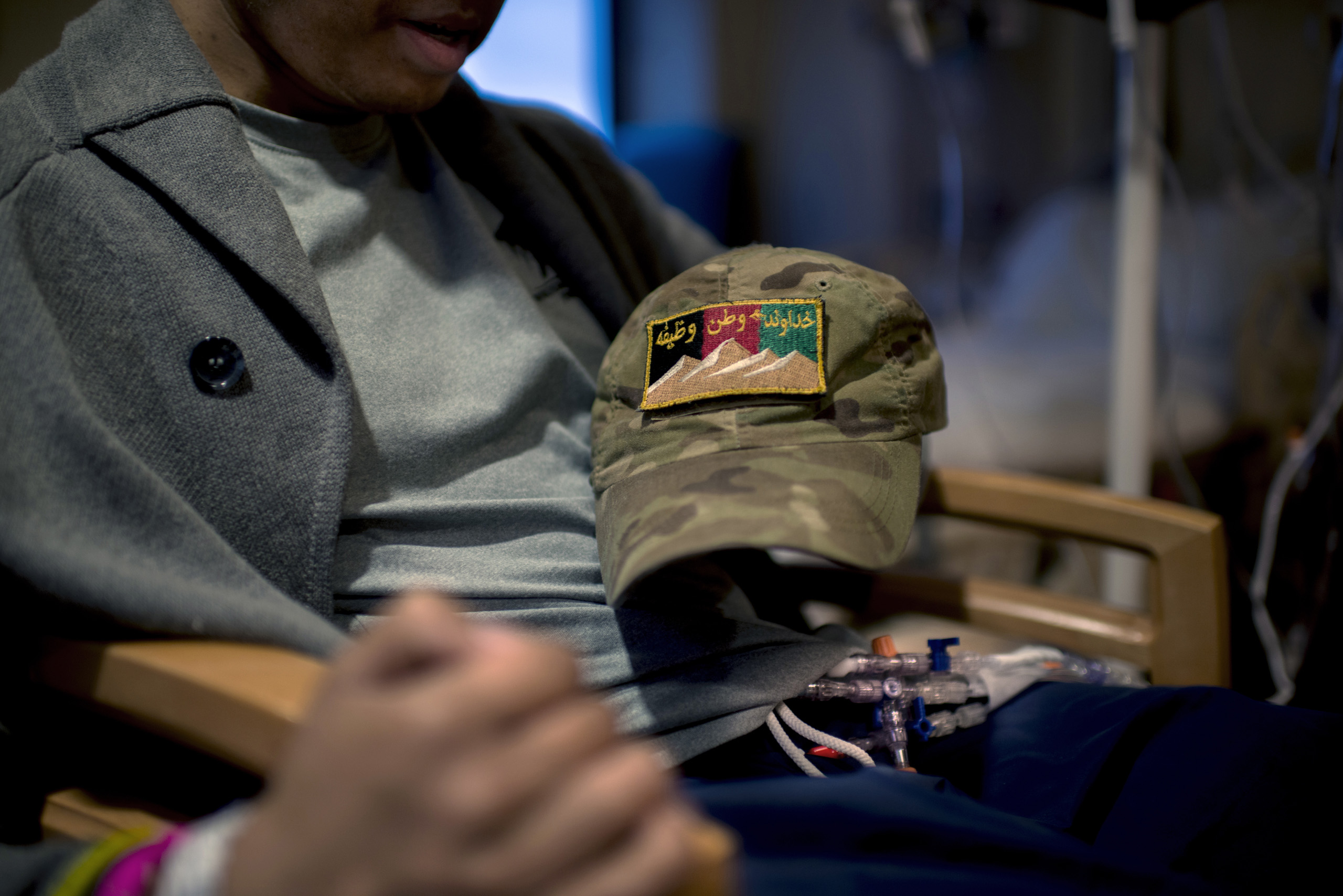 A baseball cap that Pham used to wear during his deployment that has the Afghan Army patch and  God, Duty, Country  written in Pashto on it.