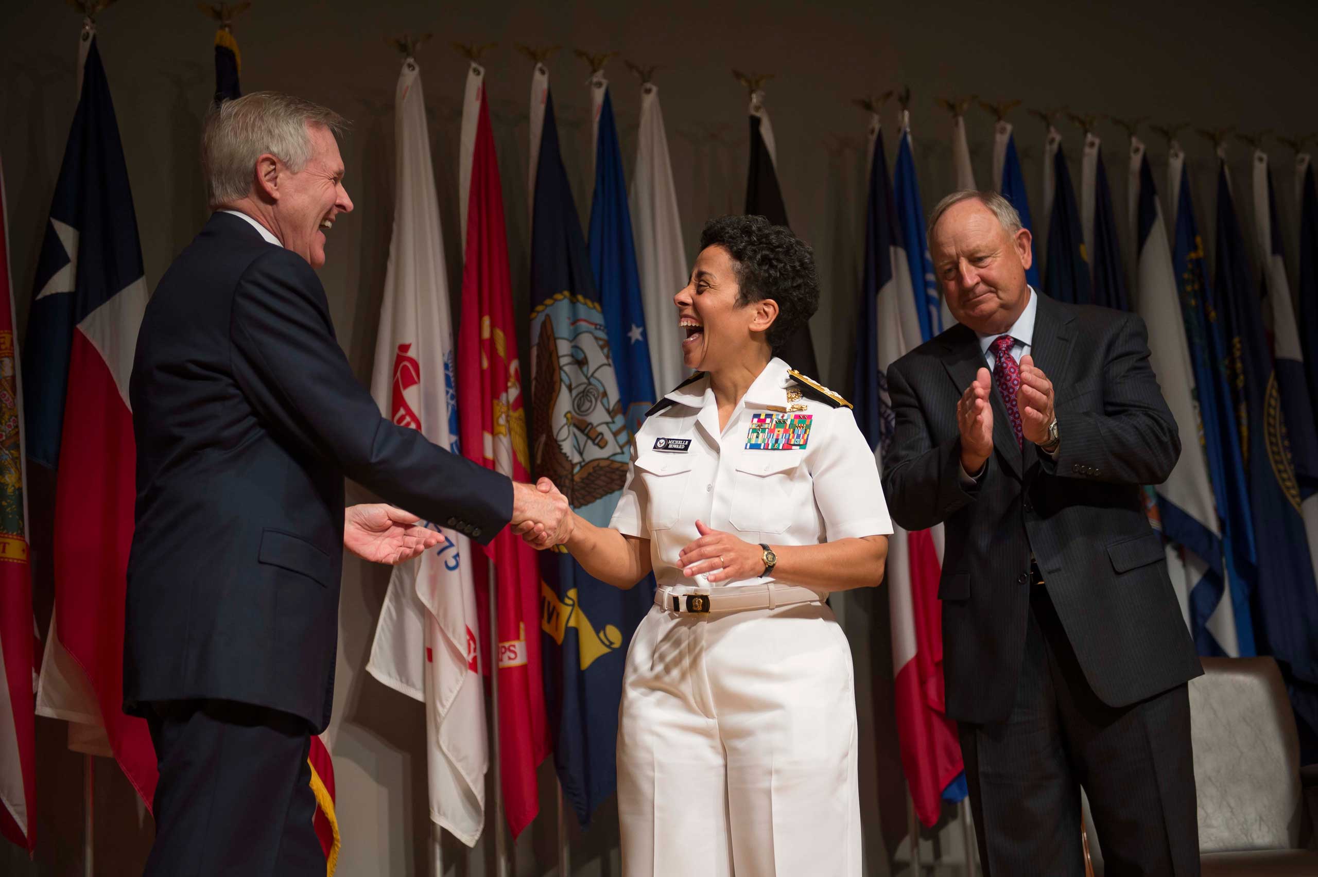 From Left: Secretary of the Navy Ray Mabus congratulates Adm. Michelle Howard after putting on her fourth star during her promotion ceremony at the Women in Military Service for America Memorial on July 1, 2014 in Washington, D.C.