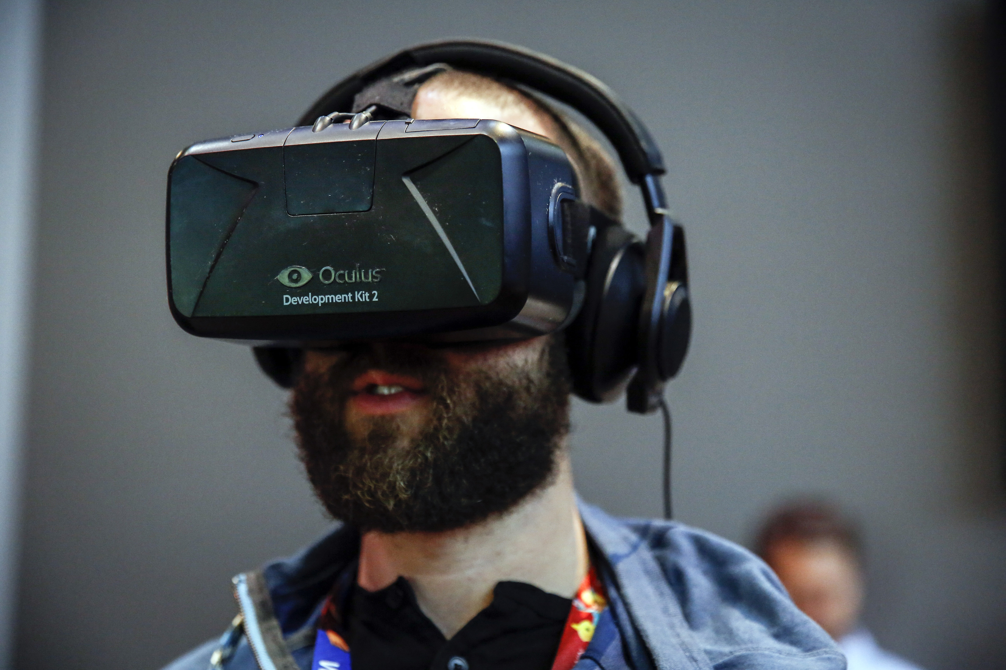 An attendee wears an Oculus VR Inc. Rift Development Kit 2 headset to play a video game during the E3 Electronic Entertainment Expo (Bloomberg&mdash;Bloomberg via Getty Images)
