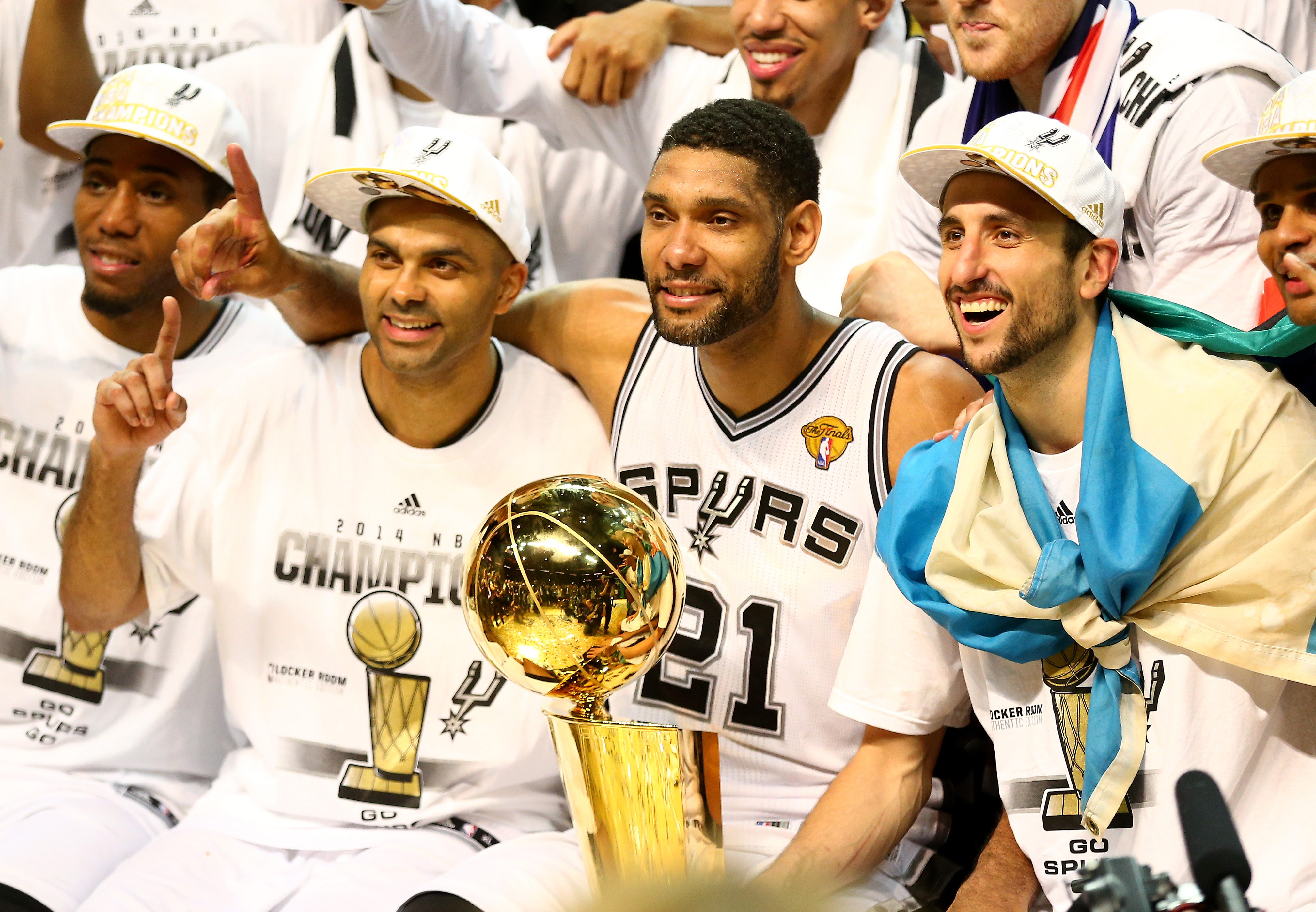 Tony Parker #9 and Tim Duncan #21, and Manu Ginobili #20 of the San Antonio Spurs celebrate after defeating the Miami Heat in Game Five of the 2014 NBA Finals at the AT&amp;T Center on June 15, 2014 in San Antonio, Texas. (Andy Lyons&mdash;Getty Images)