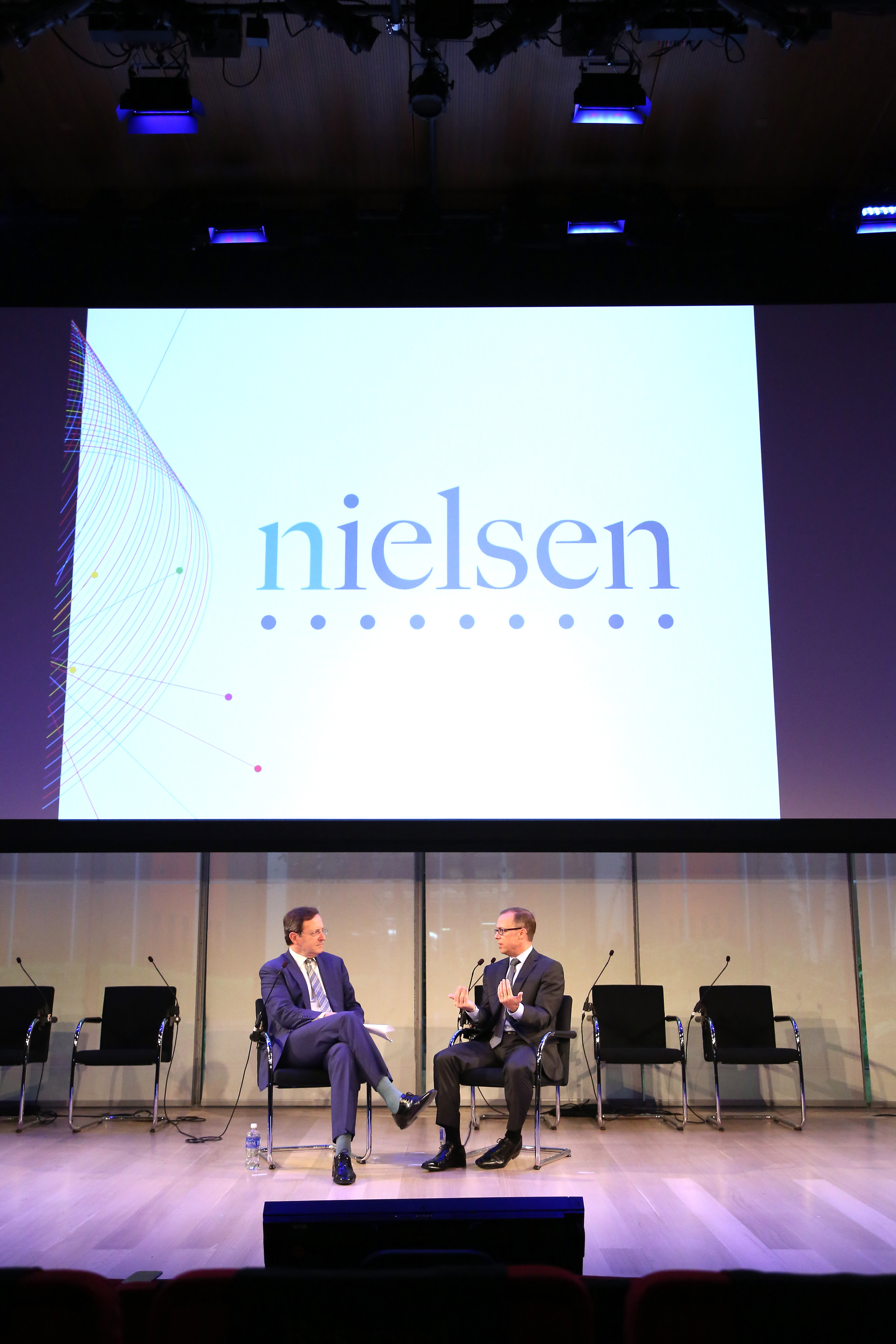 Senior Correspondent at CBS News, Anthony Mason (L) and CEO at Nielsen, Mitch Barns speak onstage at The Future of Measurement panel September 30, 2014 in New York City. (Monica Schipper—2014 Getty Images)