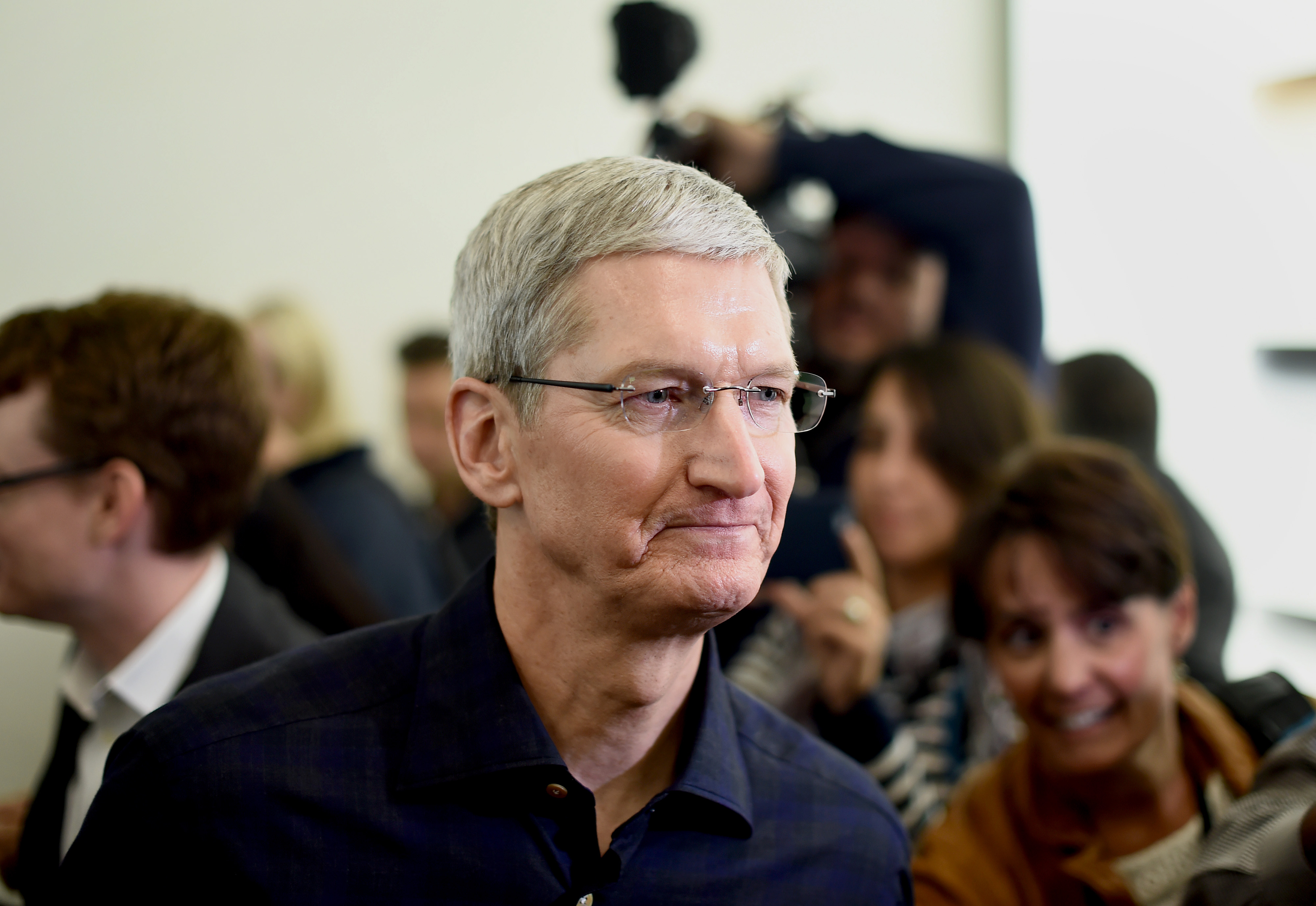 Apple CEO Tim Cook speaks with members of the media after a product announcement in Cupertino, California, U.S., on Thursday, Oct. 16, 2014. (Noah Berger—Bloomberg / Getty Images)