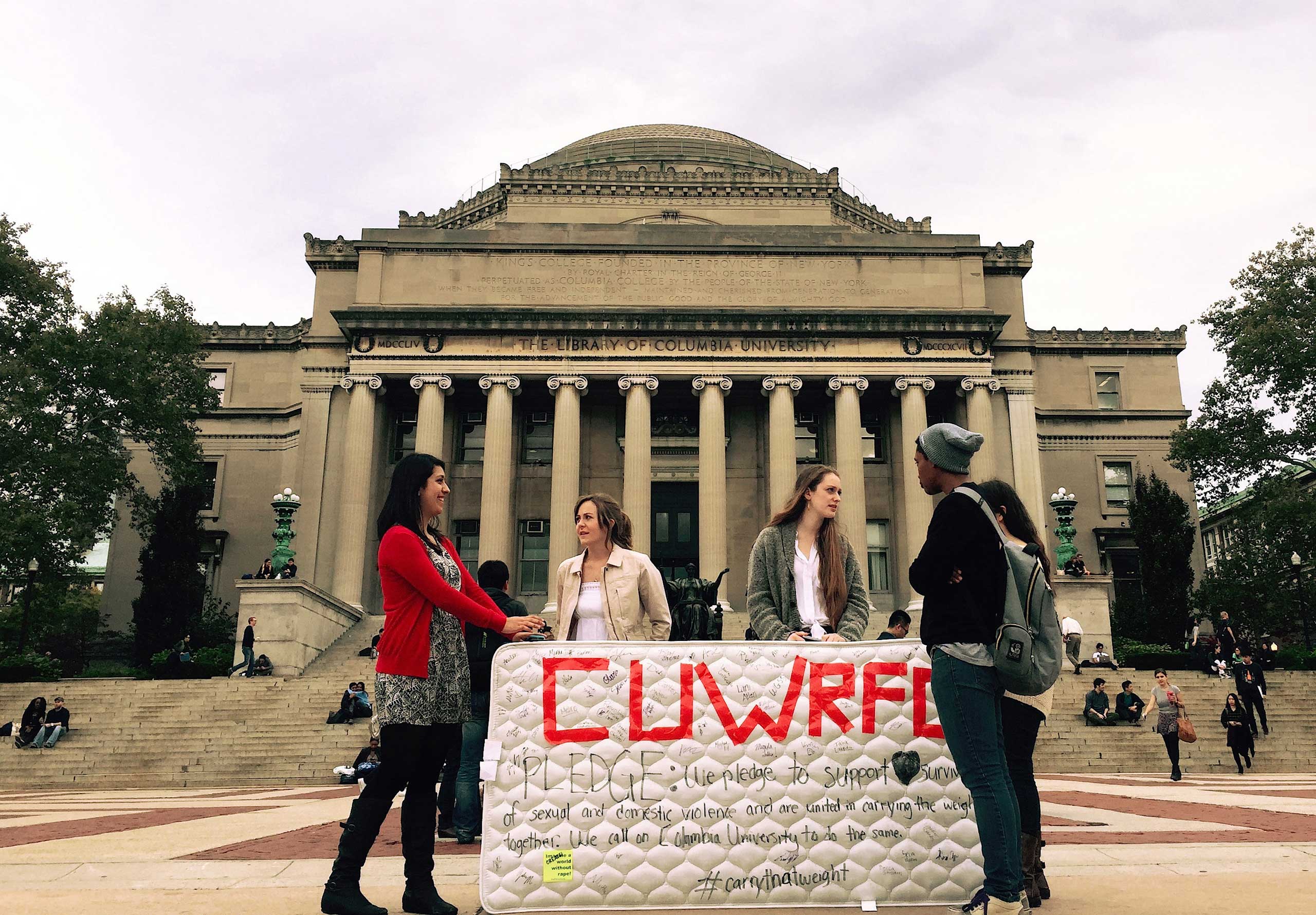 Student protesters stand in front of the Library of Columbia University, New York, Oct. 29, 2014. (Selcuk Acar—Anadolu Agency/Getty Images)