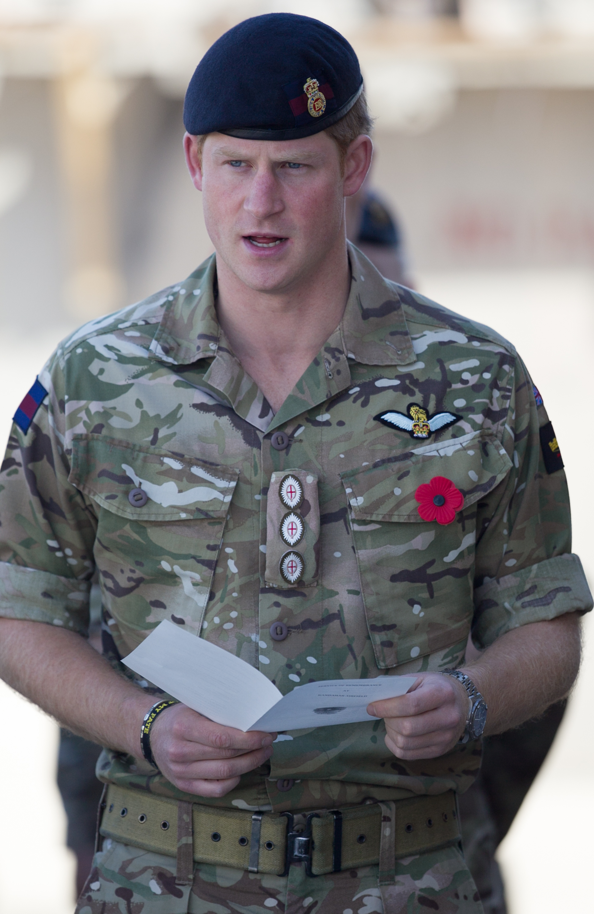 Prince Harry joins British troops and service personal remaining in Afghanistan and also International Security Assistance Force (ISAF) personnel and civilians as they gather for a Remembrance Sunday service at Kandahar Airfield November 9, 2014 in Kandahar, Afghanistan. (Matt Cardy—Getty Images)