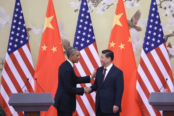 President Barack Obama shakes hands with Chinese President Xi Jinping after a joint press conference at the Great Hall of People in Beijing on Nov. 12, 2014. (Feng Li—Getty Images)