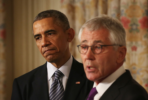 President Obama listens as Defense Secretary Chuck Hagel announces he is resigning after less than two years as defense chief. (Alex Wong / Getty Images)