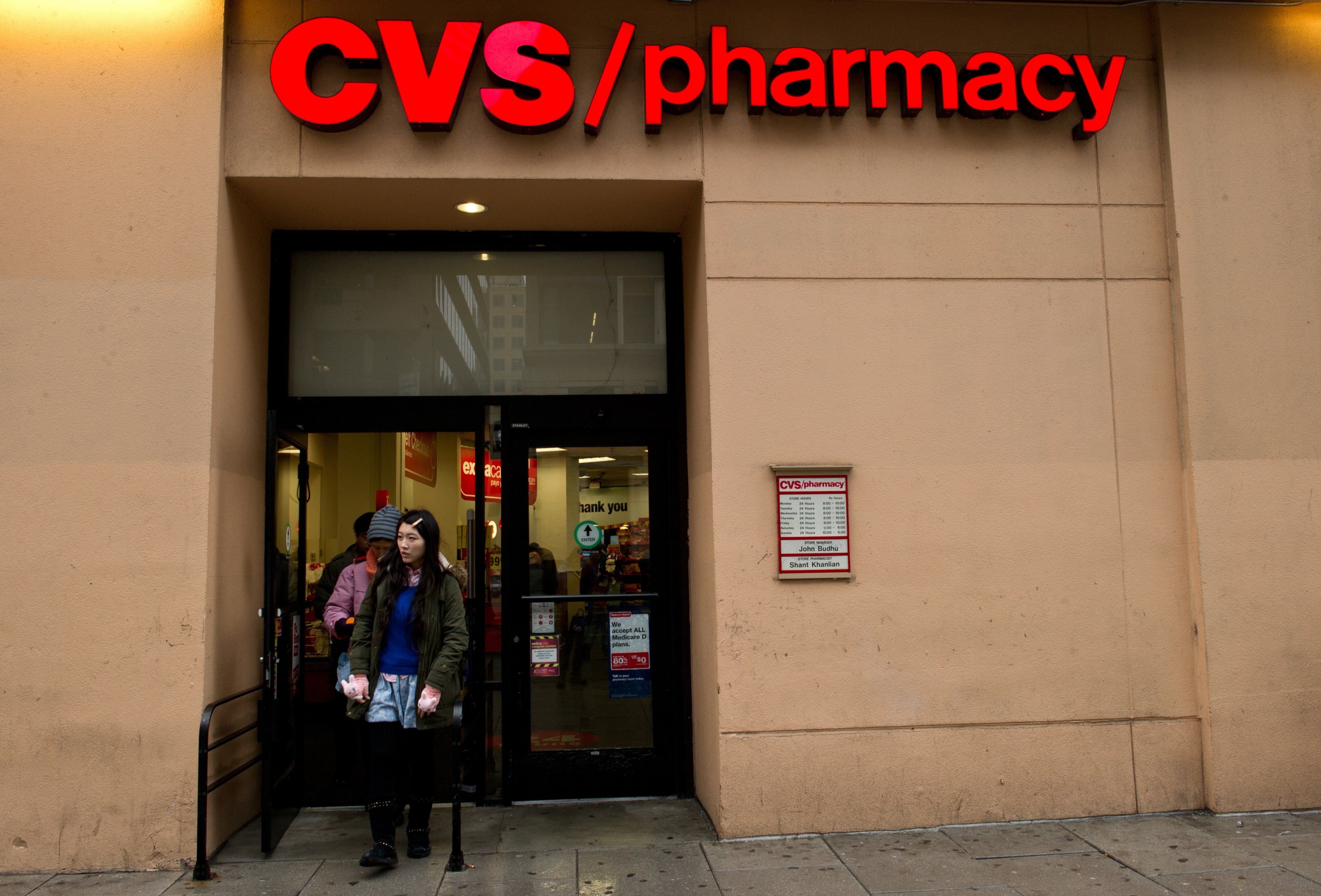 Patrons leave a CVS drugstore February 5, 2014 in Washington, DC. The second largest US drugstore chain, CVS, announced Wednesday it will stop selling cigarettes by the end of the year (Karen Bleier—AFP/Getty Images)