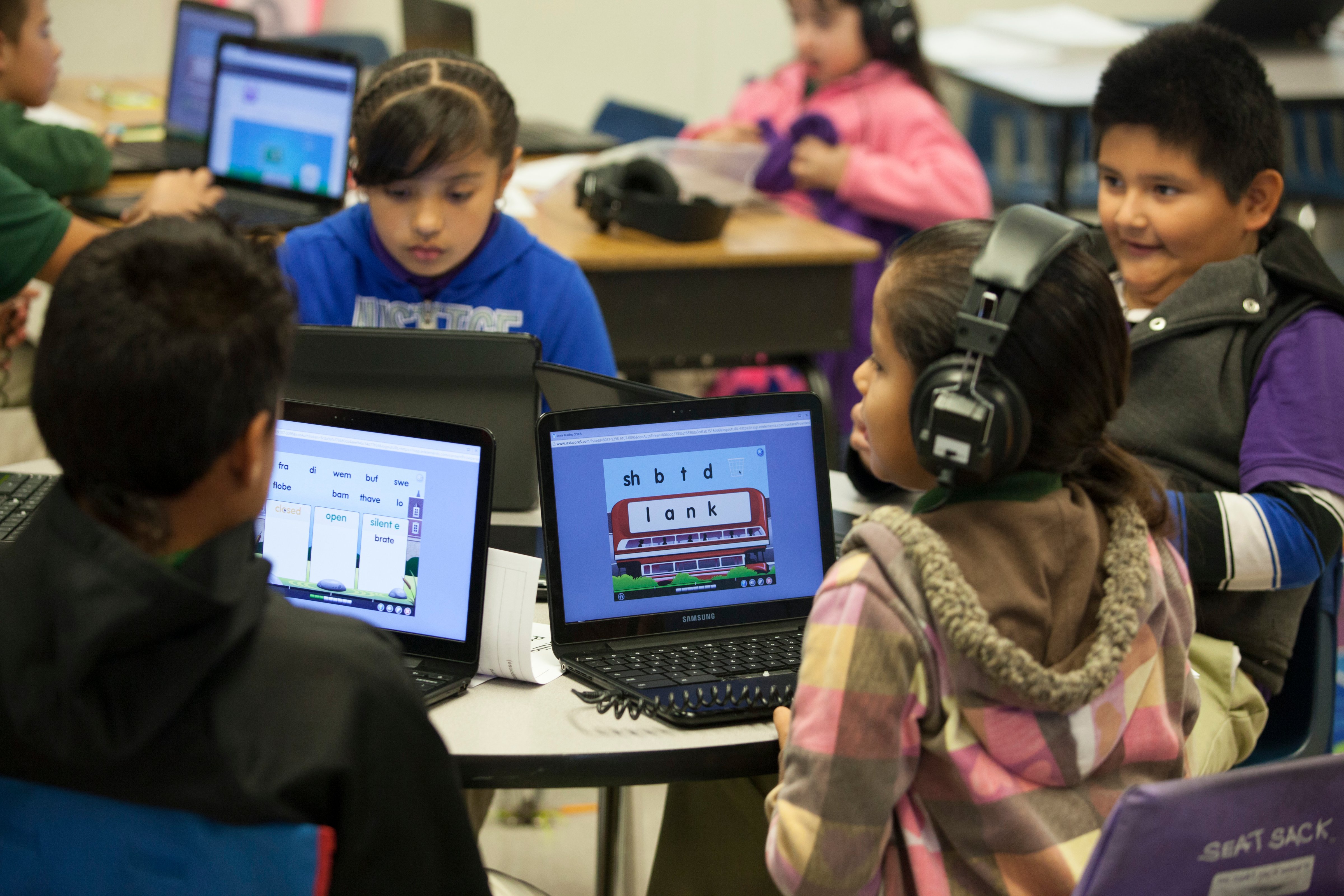 Fourth and fifth grade students at Rocketship SI Se Puede, a charter, public elementary school, use the internet and traditional classroom learning in one big open classroom, on Feb. 18, 2014 in San Jose, Calif. (Christian Science Monitor/Getty)