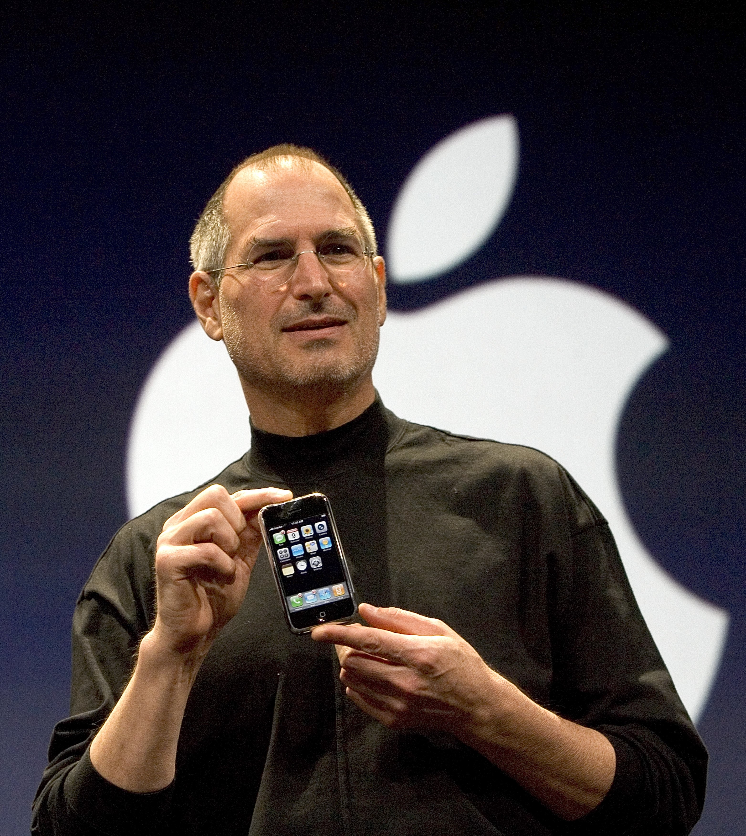 Apple CEO Steve Jobs holds up the new iPhone that was introduced at Macworld in San Francisco on Jan. 9, 2007 (David Paul Morris—Getty Images)