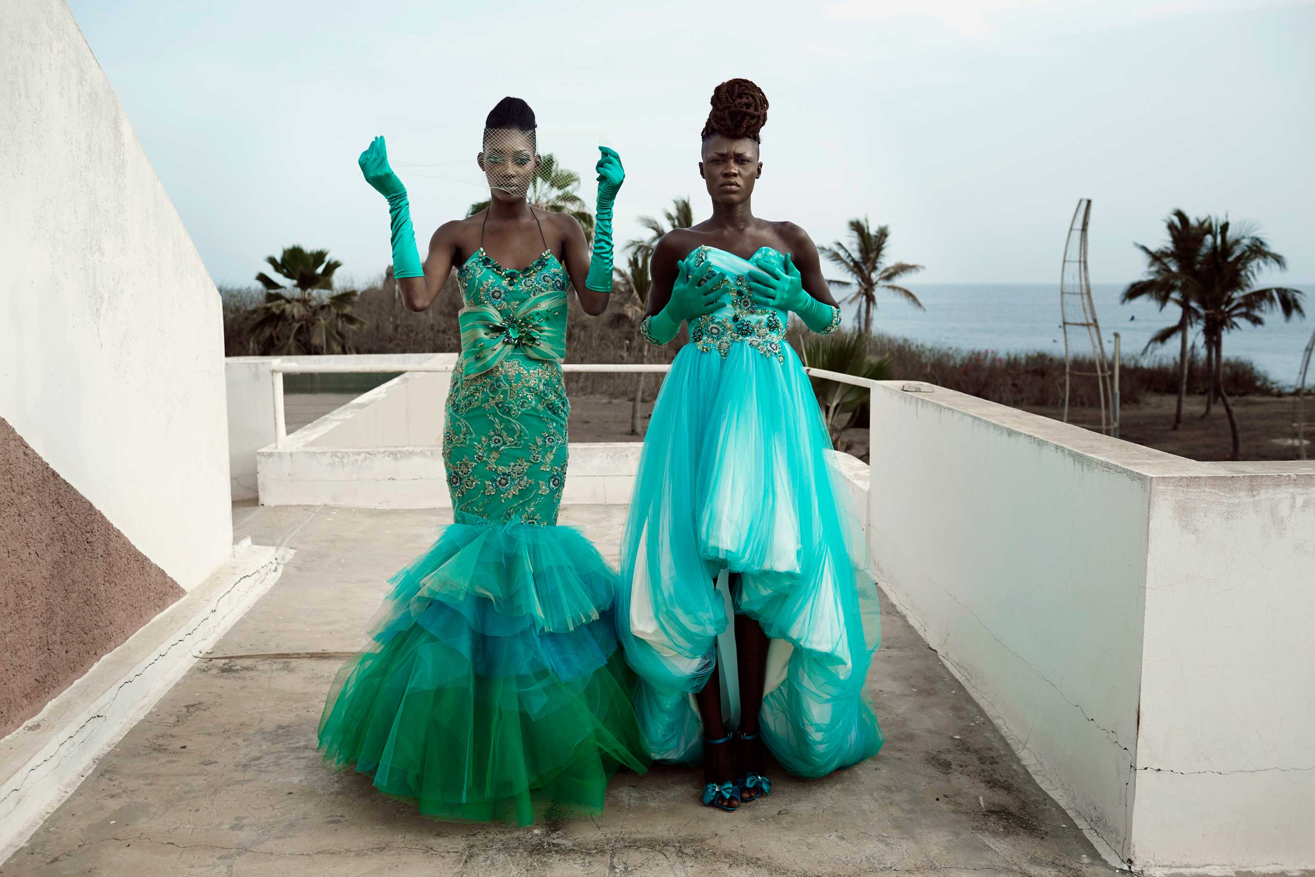 Models fit dresses for the Cameroonian, Paris- based, designer Martial Tapolo Couture before a show at Dakar Fashion Week on June 20, 2014, at Hotel des Almadies in Dakar, Senegal.