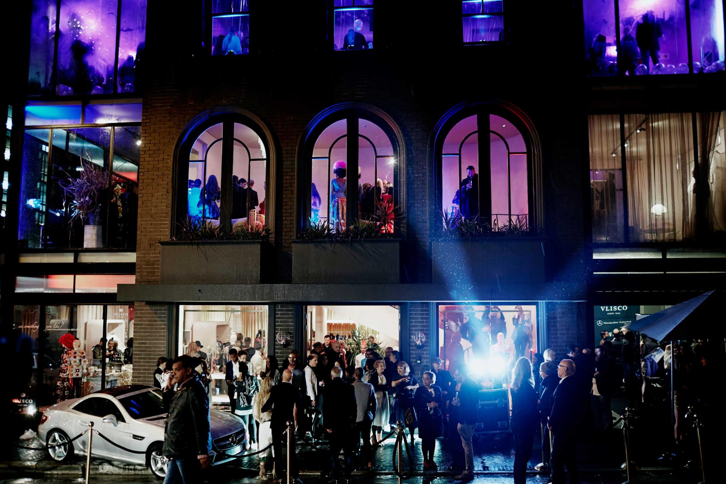 Guests arrive during an installation show at the new Klûk CGDT flagship store during Mercedes-Benz Fashion Week on July 26, 2014, in Cape Town, South Africa.