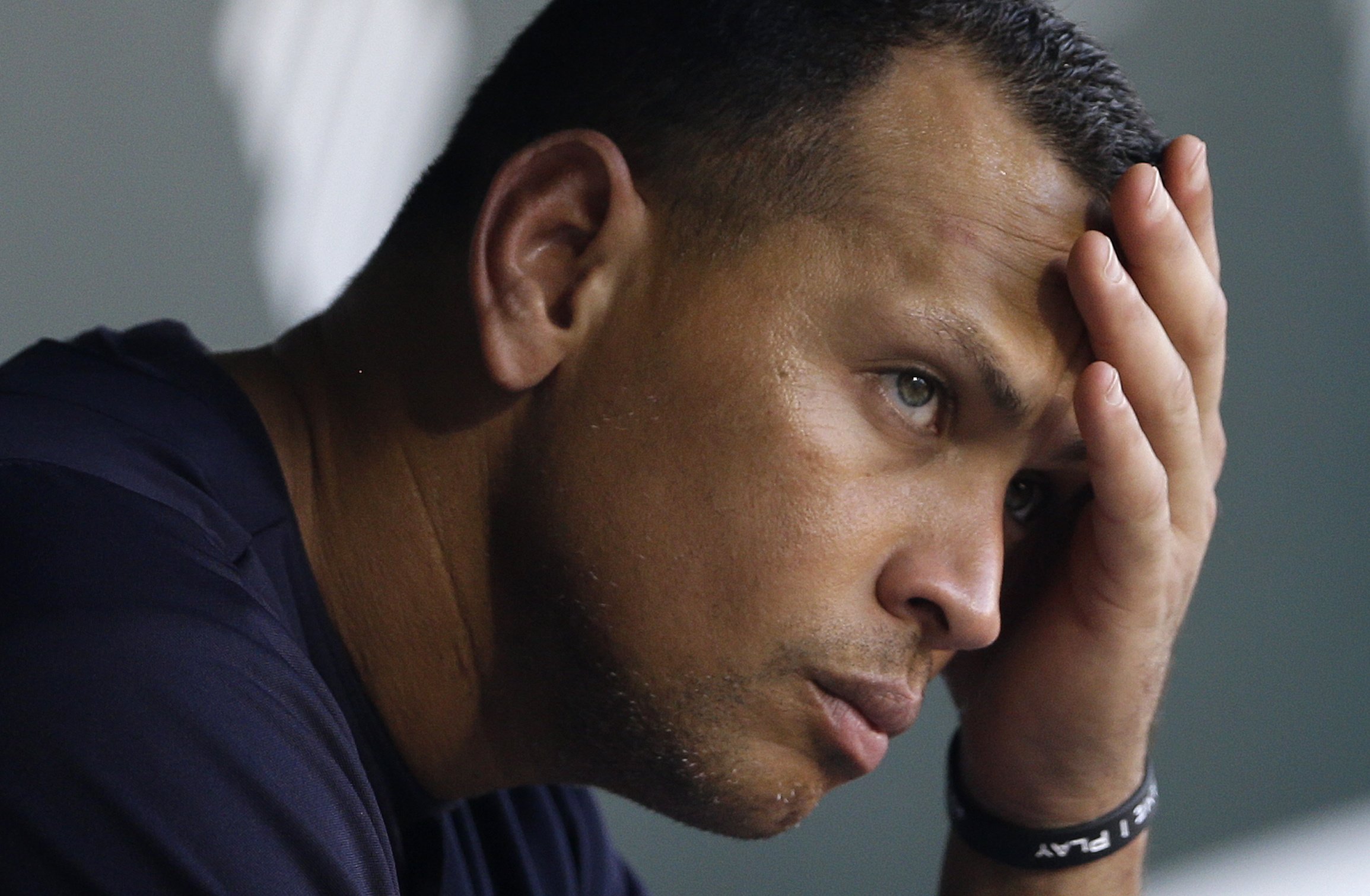 New York Yankees' Alex Rodriguez wipes sweat from his brow as he sits in the dugout before a baseball game against the Baltimore Orioles in Baltimore on Sept. 11, 2013.