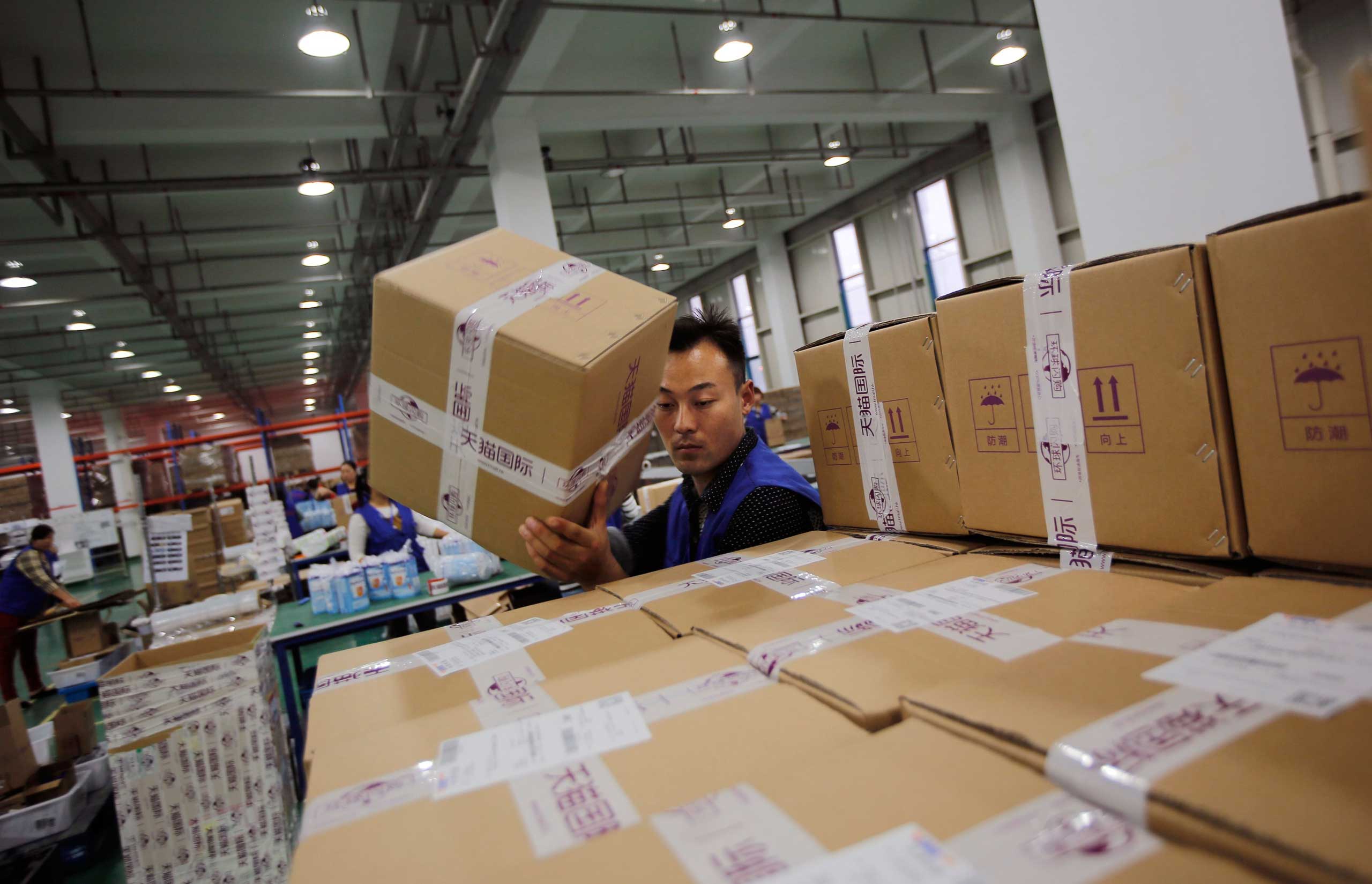 An employee works at an Alibaba Group warehouse on the outskirts of Hangzhou, China on Oct. 30, 2014. (Carlos Barria—Reuters)
