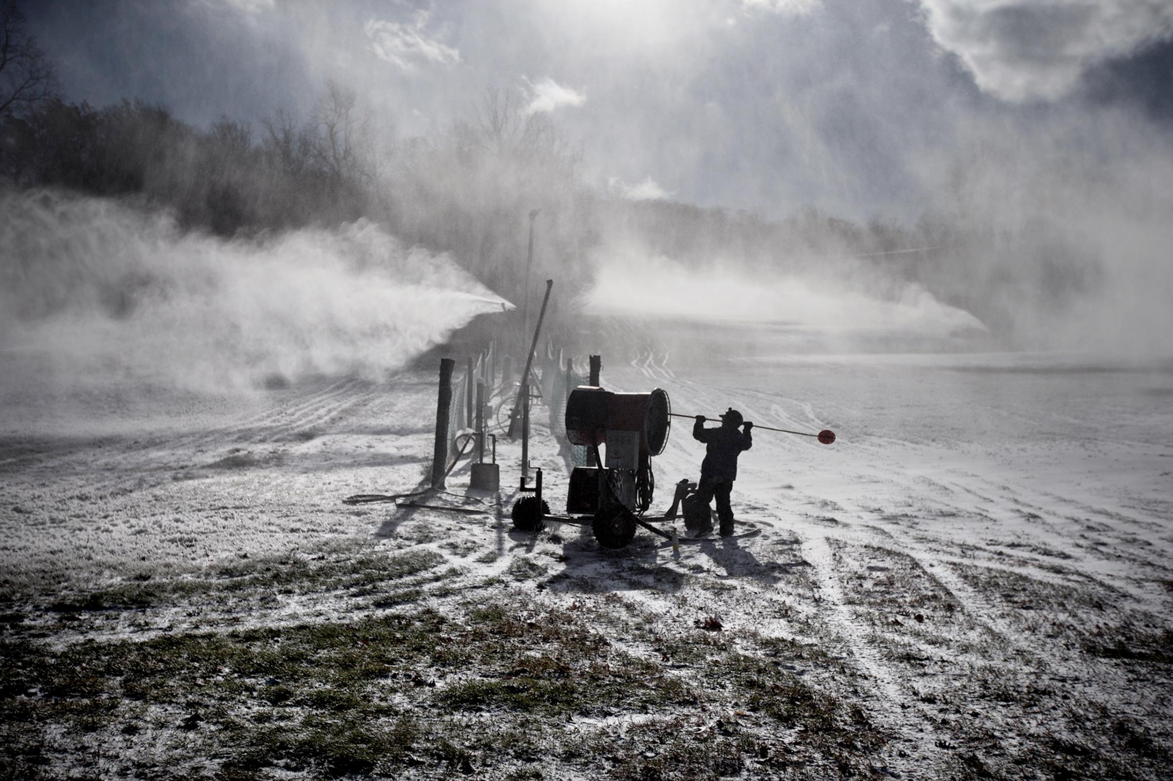 A Roundtop Mountain Resort employee makes snow in Lewisberry, Pa. on Nov. 18, 2014, as arctic air arrived in the mid state area with temperatures struggling to reach 30 degrees.
