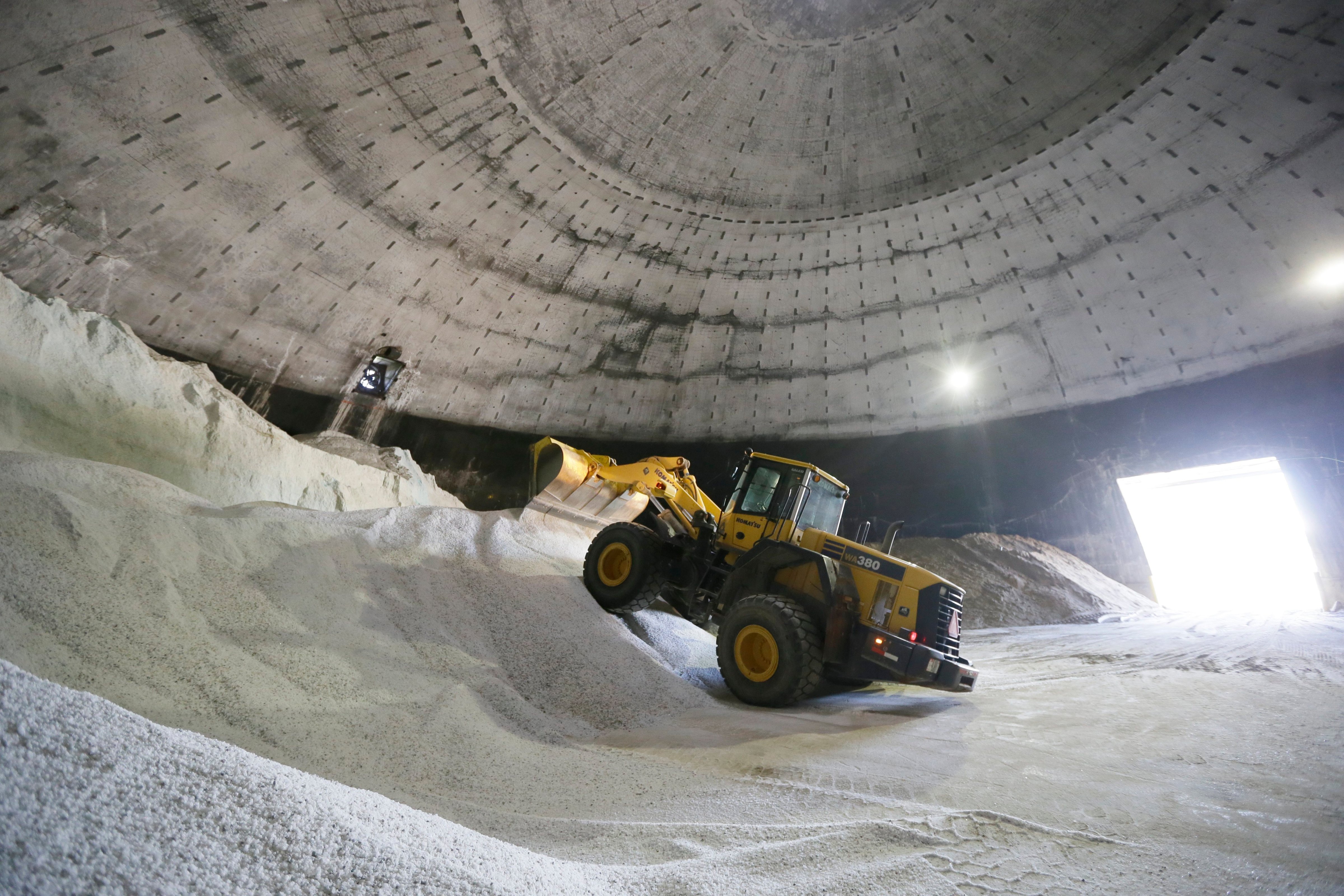 Salt is unloaded at the Scio Township, Mich. maintenance yard on Sept. 16, 2014. Some Midwest county road officials are facing price increases that are three times what they paid last year. (Carlos Osorio—AP)