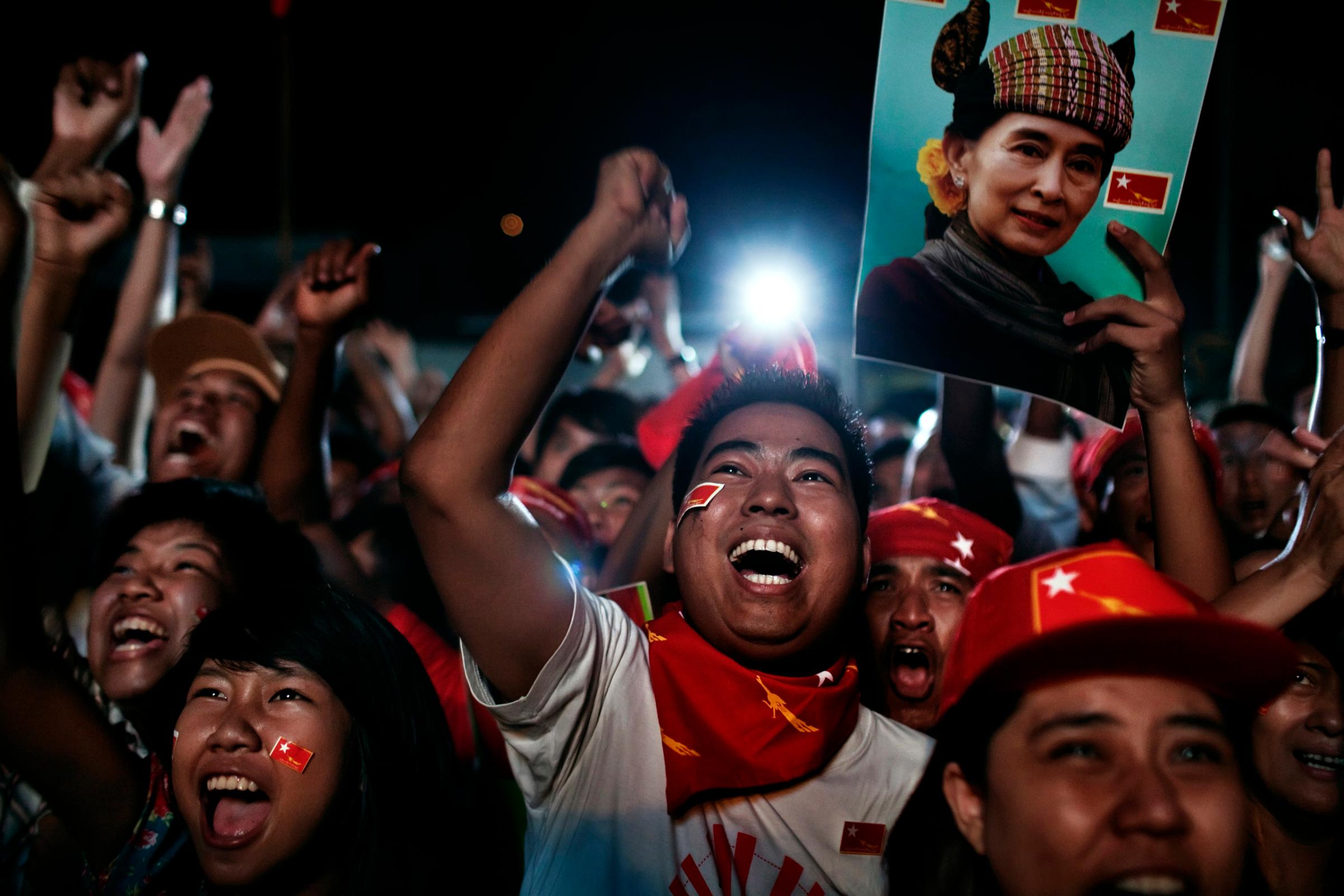 National League for Democracy (NLD) supporters celebrate at their headquarters as they watch election results Yangon, Burma, Apr. 1, 2012.