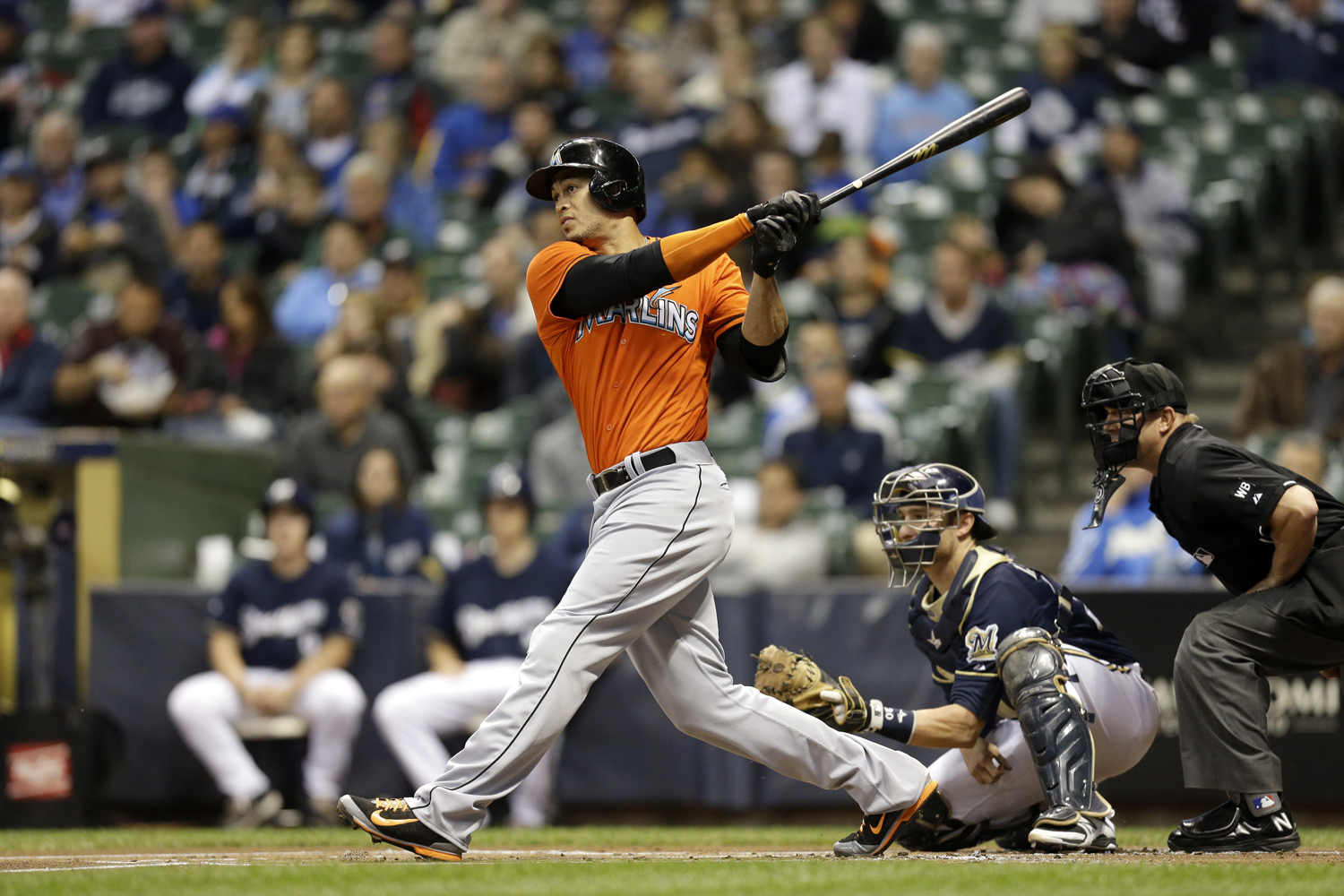 Giancarlo Stanton of the Miami Marlins makes some contact at the plate during a game against the Milwaukee Brewers at Miller Park on September 11, 2014 in Milwaukee, Wisconsin. (Mike McGinnis — Getty Images)
