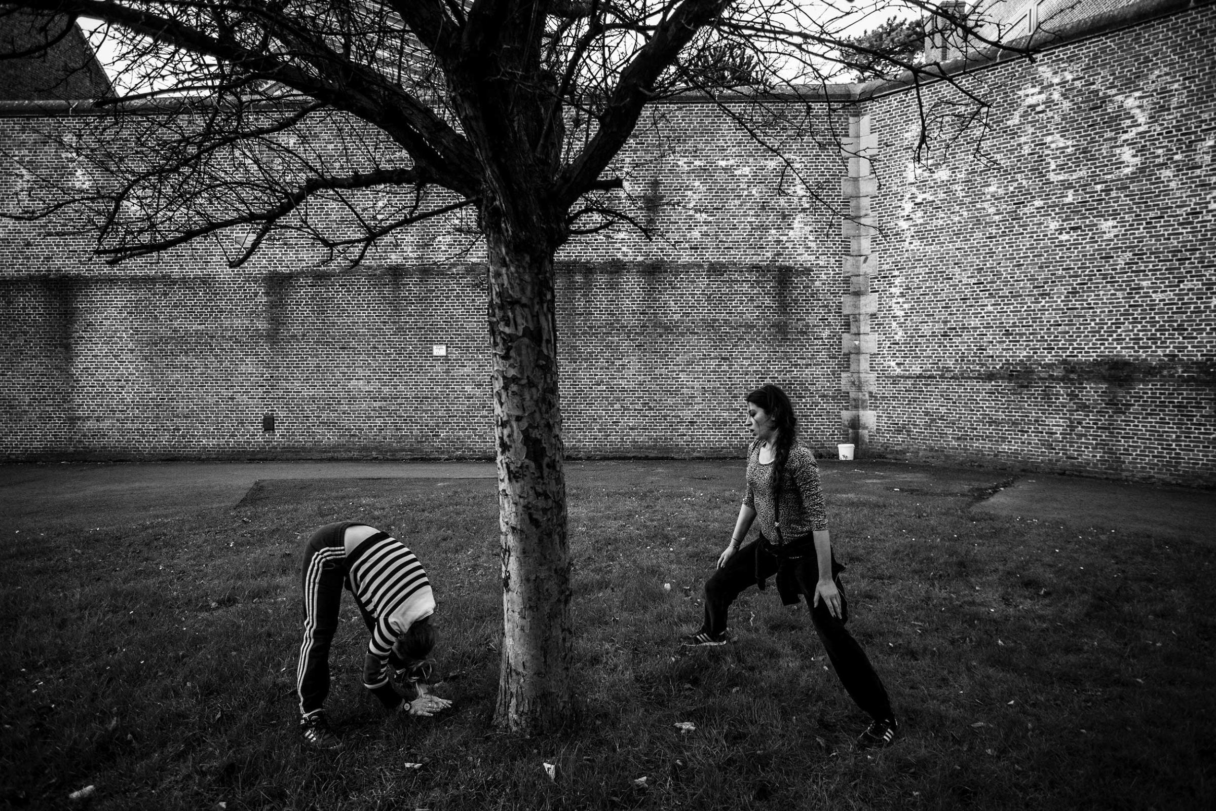 Female prisoners are exercising inside the courtyard of the prison of Ghent. They said that it was the only thing they could do to keep their mind occupied. Ghent, December 2013.