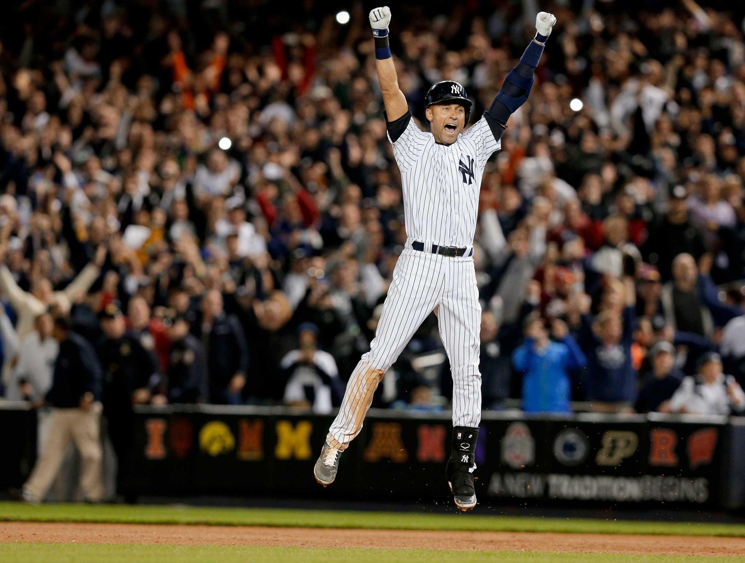 New York Yankees' Derek Jeter jumps after hitting the game-winning single against the Baltimore Orioles in the ninth inning of a baseball game, New York, Sept. 25, 2014.