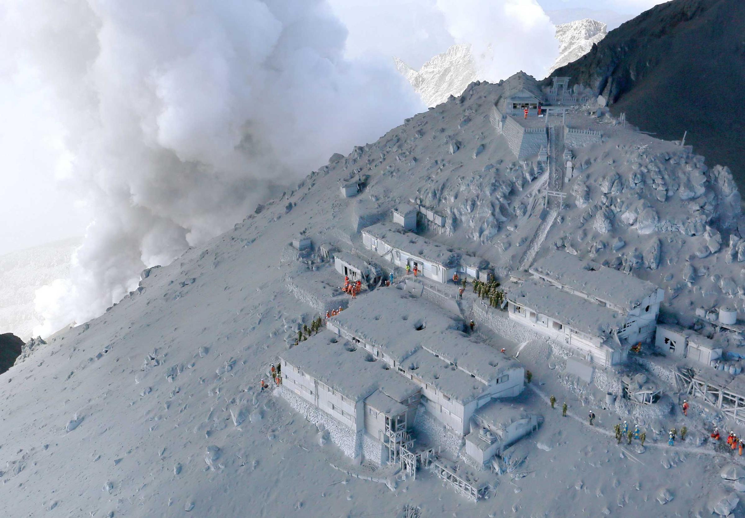 Mountain lodges near the top of Mt. Ontake in Tokyo, Japan are covered in volcano ash, Sept. 28, 2014.