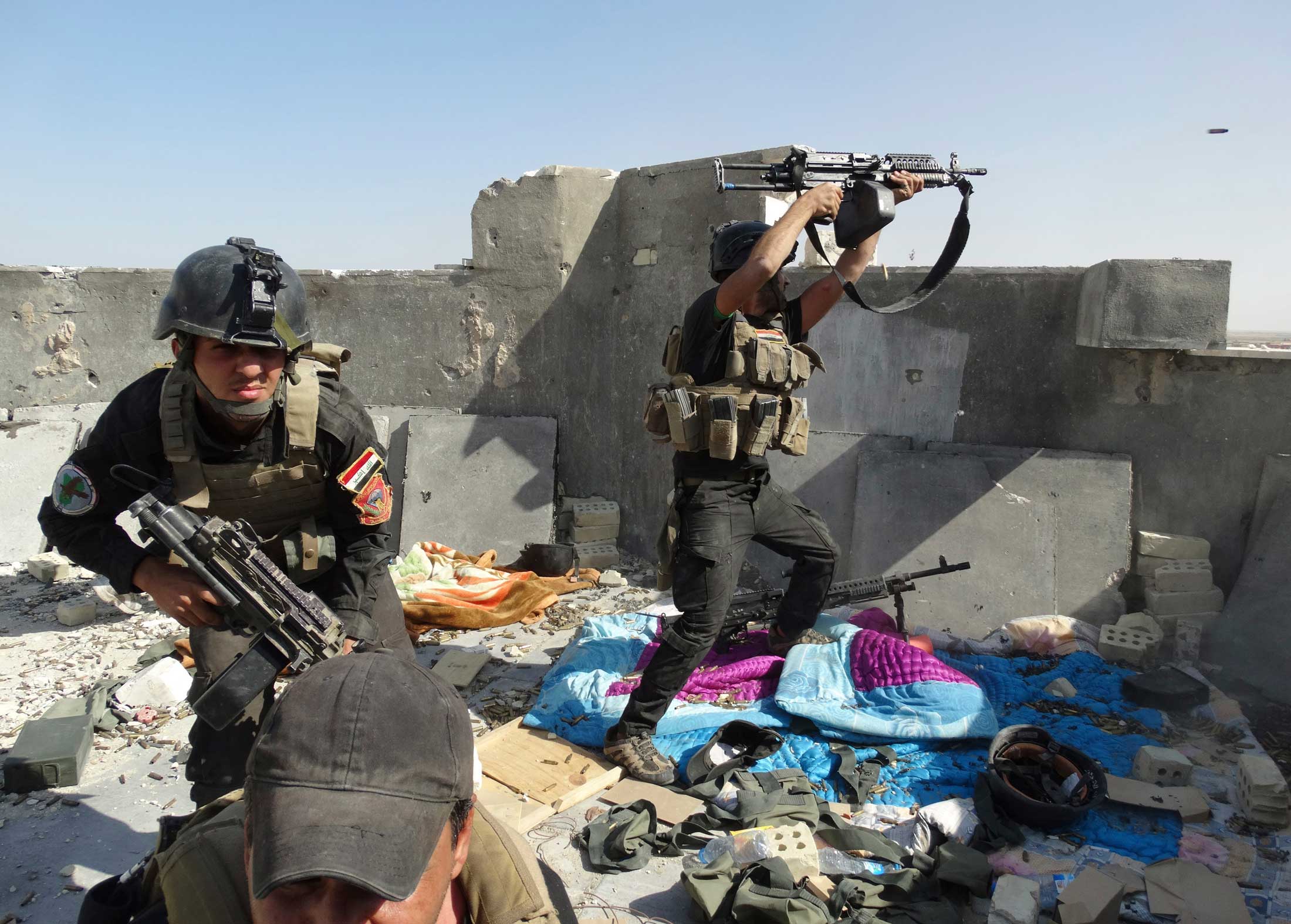 Members of the Iraqi Special Operations Forces take their positions during clashes with the al Qaeda-linked Islamic State of Iraq and Syria (ISIS) in the city of Ramadi.
