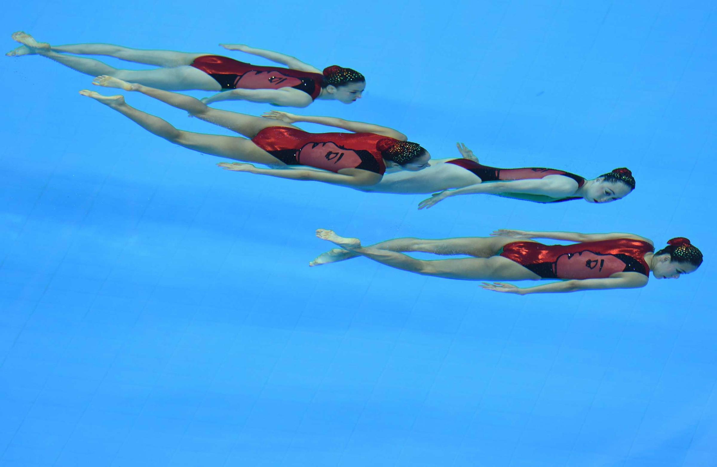 Japan's swimmers compete in the free combination synchronised swimming event final during the 2014 Asian Games at the Munhak Park Tae-hwan Aquatics Centre in Incheon, Sept. 23, 2014.