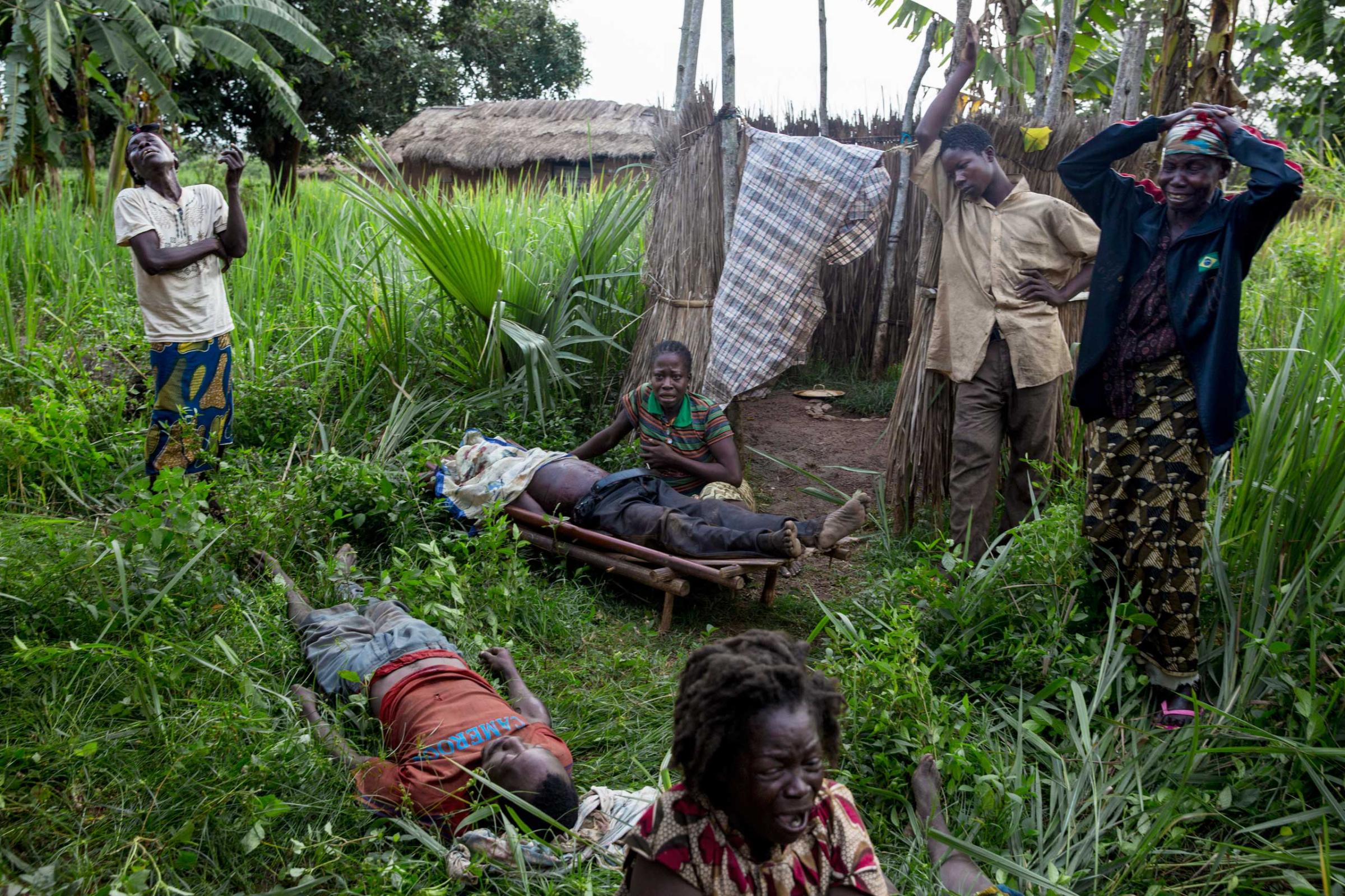 Relatives mourn the death of two men and one woman, murdered by Seleka fighters, April 14, 2014.