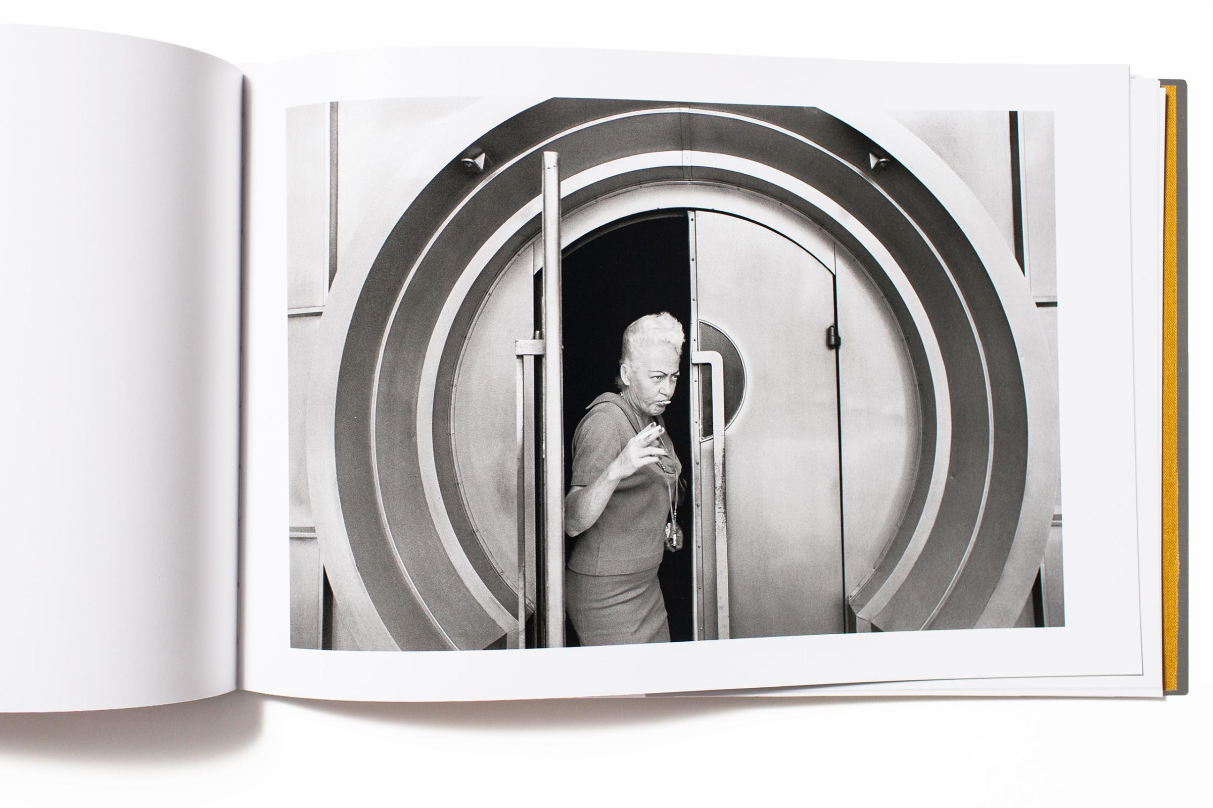 "How can a book comprised of twelve images of something so ordinary as people exiting a door in Los Angeles (that looks oddly at first like a bank vault) captivate interest and validate itself as a book? Anthony HernandezÕs LA, 1971 is a prime example. Is this an early work by the artist inspired and based in conceptualism or simply a string of images that share common elements and form? L.A. 1971 is a surprising and beautiful find from The Silas Finch Foundation."-Jeffery Ladd, photographer, writer and publisher of Errata Editions