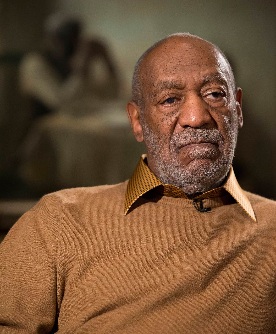 Bill Cosby sits for an interview about the exhibit, Conversations: African and African-American Artworks in Dialogue, at the Smithsonian's National Museum of African Art in Washington on Nov. 6, 2014. (Evan Vucci—AP)