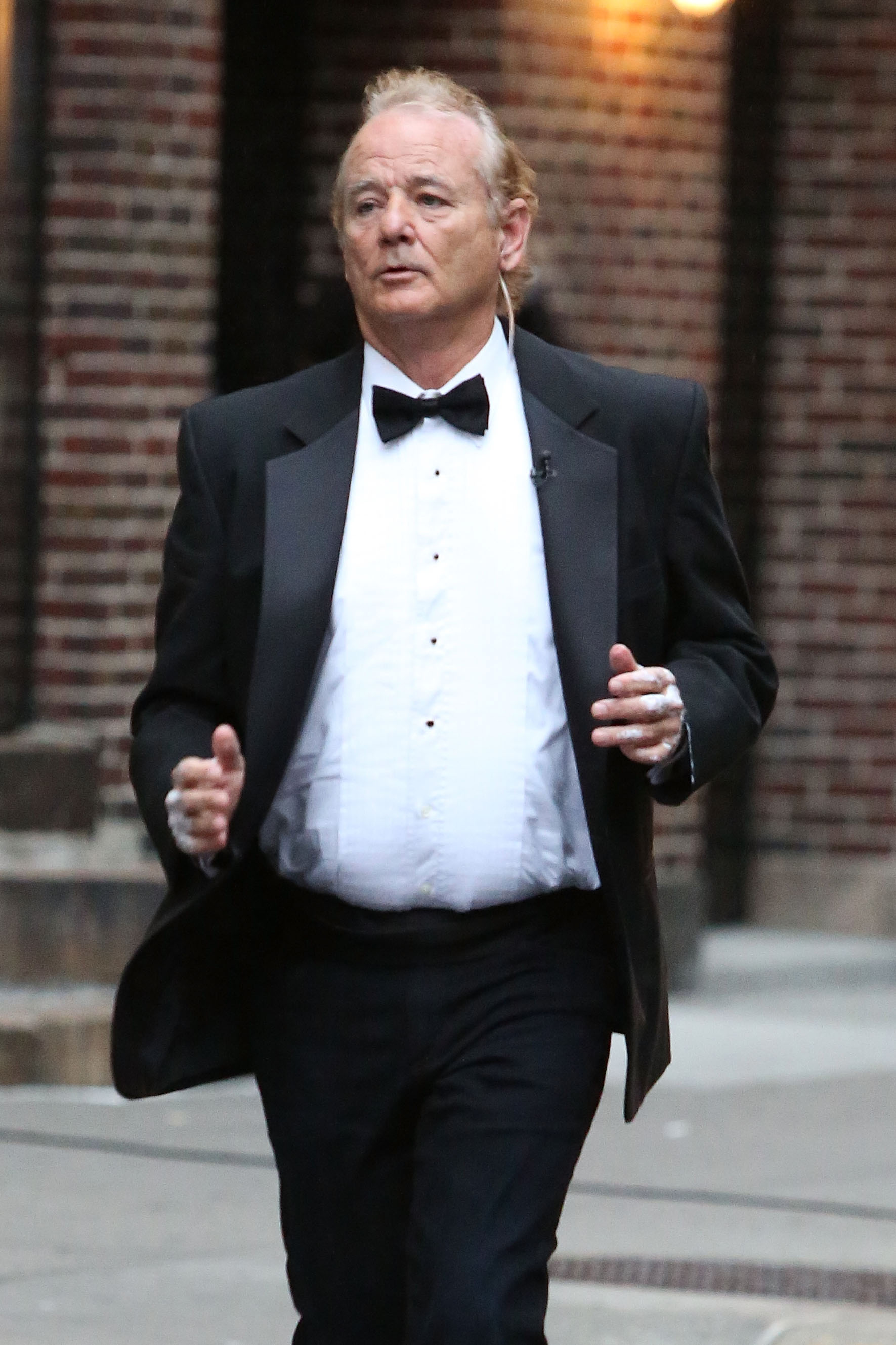 Actor Bill Murray goes jogging in black tie outside of "Late Show with David Letterman" on October 15, 2014 in New York City.